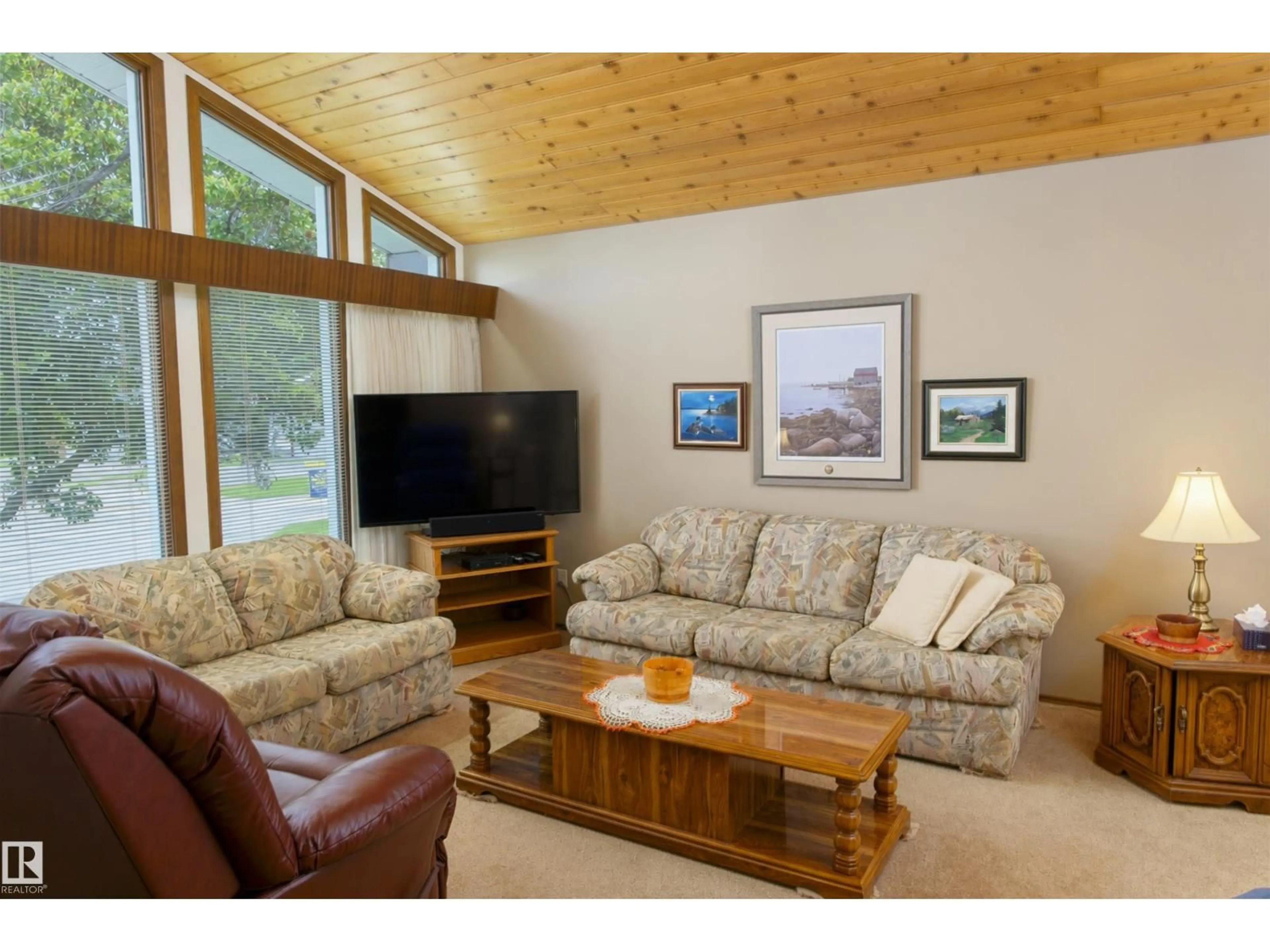 Living room with furniture, wood/laminate floor for 4906 43A ST, Barrhead Alberta T0G0E0