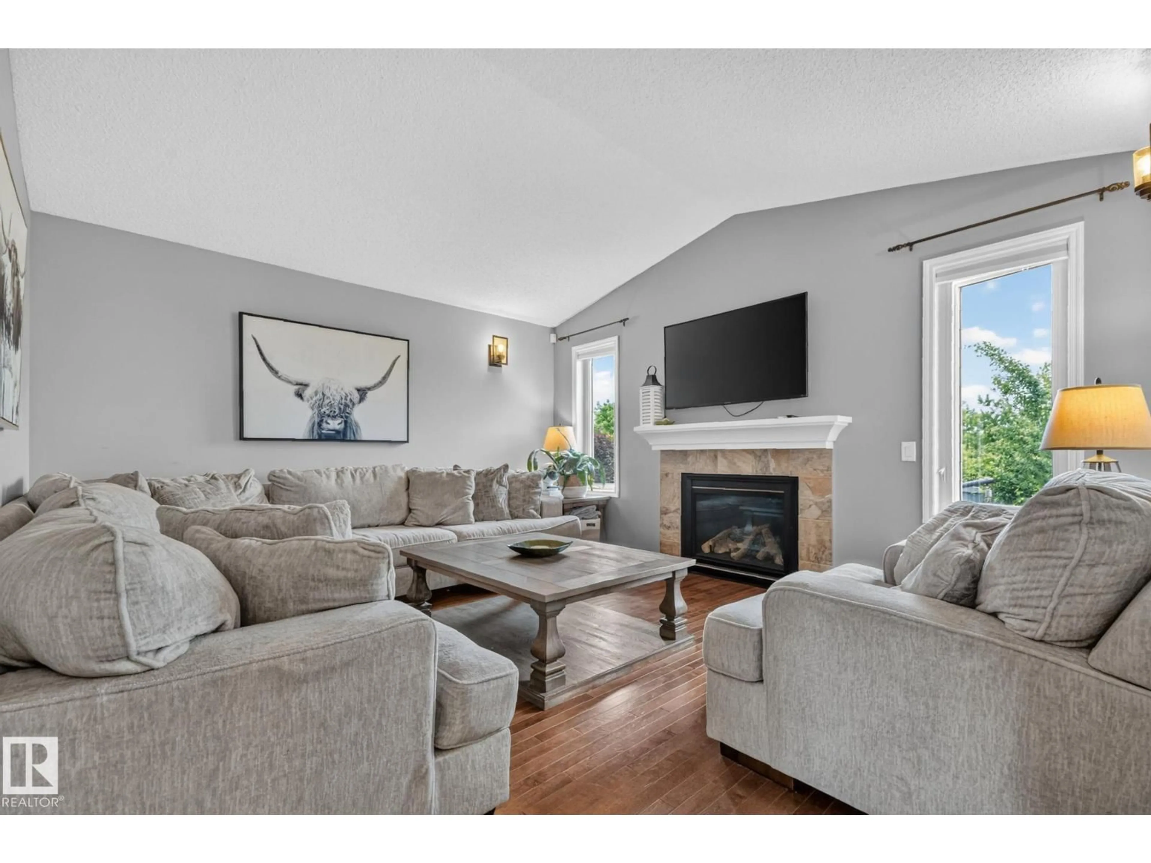 Living room with furniture, wood/laminate floor for 5204 159 AV, Edmonton Alberta T5Y0M4
