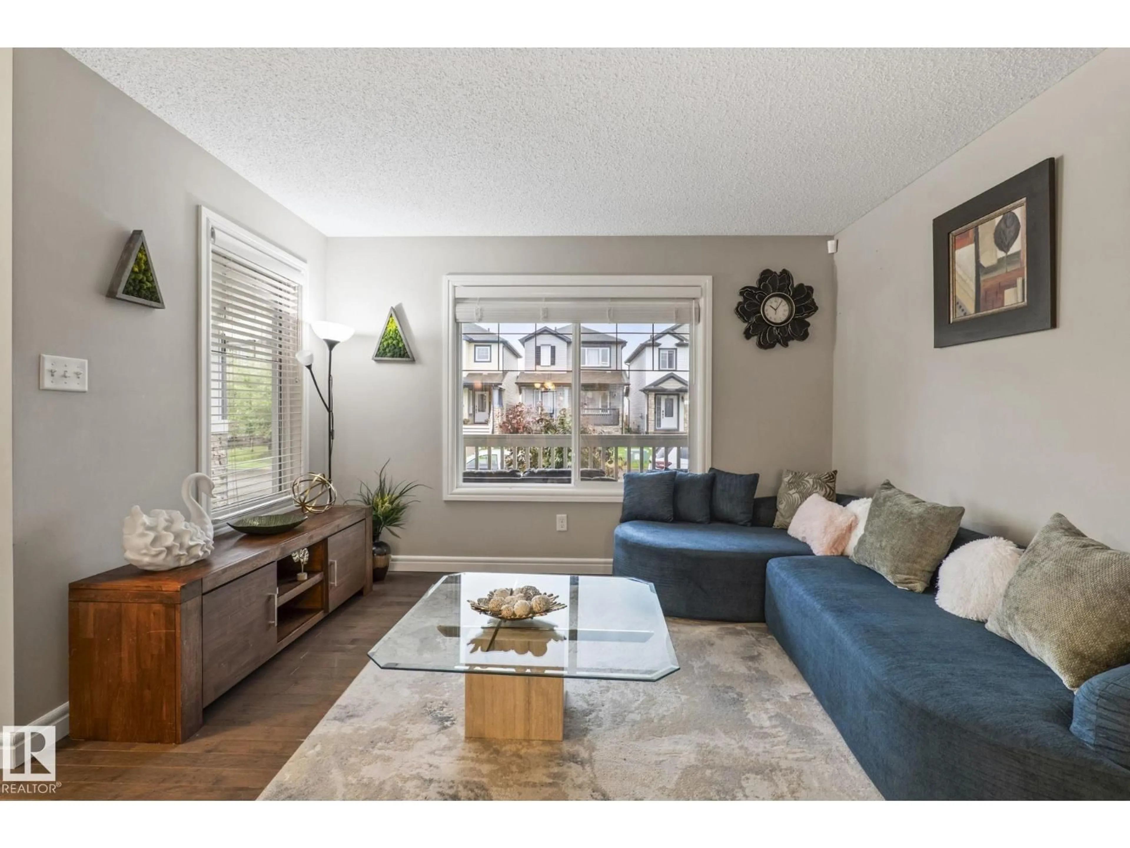 Living room with furniture, wood/laminate floor for 1542 33A ST, Edmonton Alberta T6T0X5