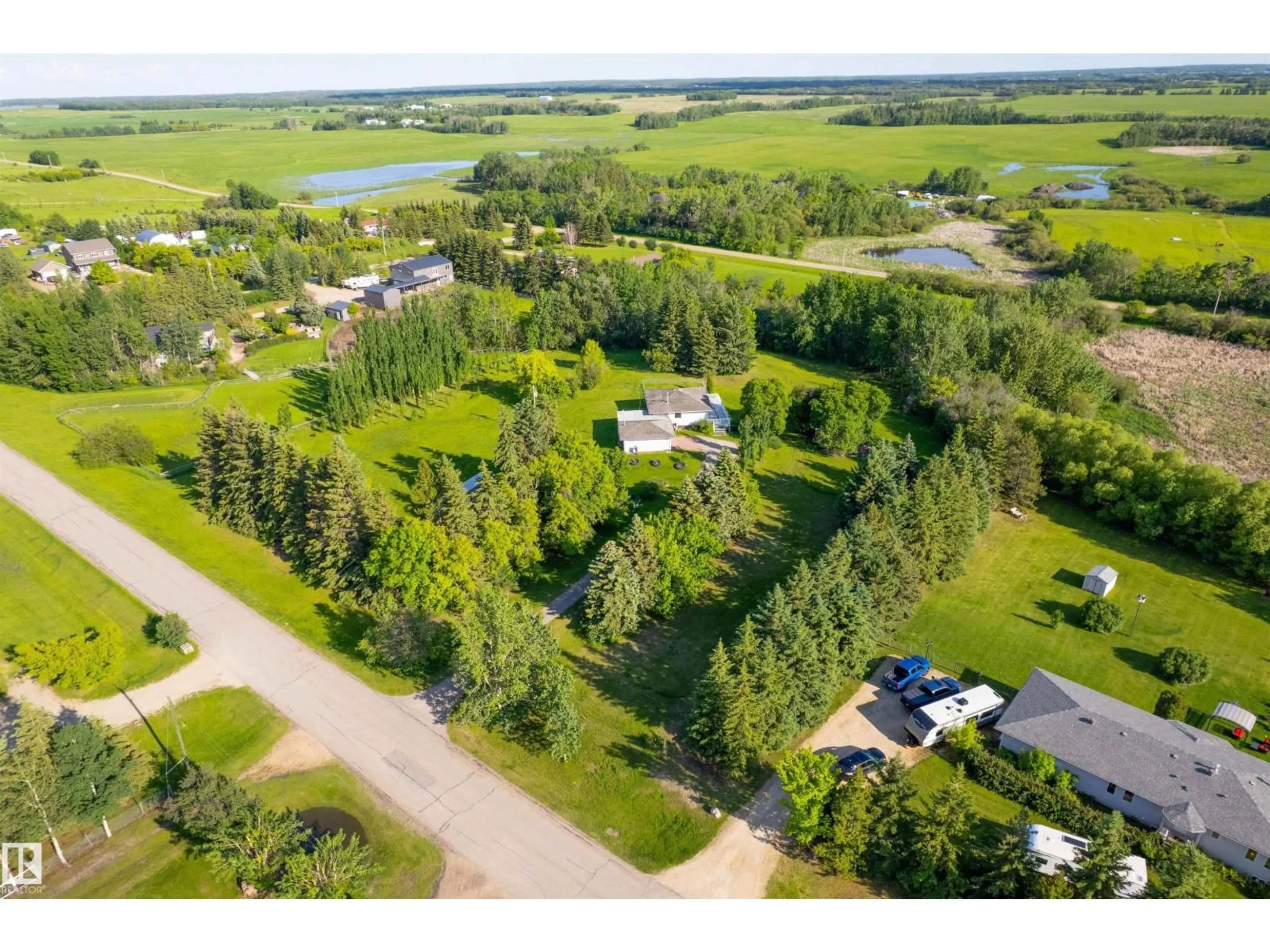 A pic from outside/outdoor area/front of a property/back of a property/a pic from drone, water/lake/river/ocean view for 73 21252 TWP ROAD 540, Rural Strathcona County Alberta T8G2A2