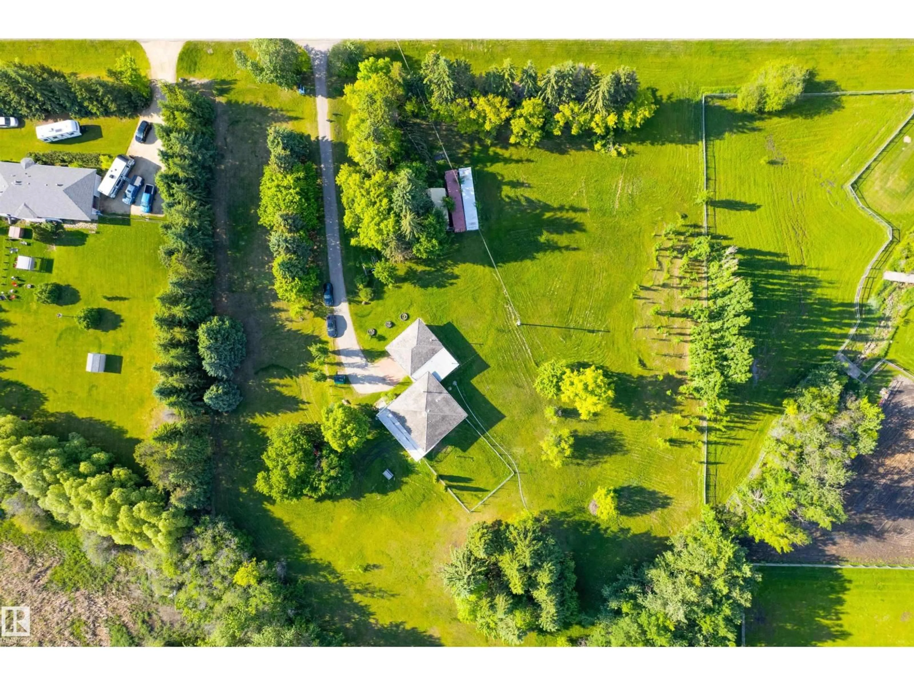 A pic from outside/outdoor area/front of a property/back of a property/a pic from drone, unknown for 73 21252 TWP ROAD 540, Rural Strathcona County Alberta T8G2A2