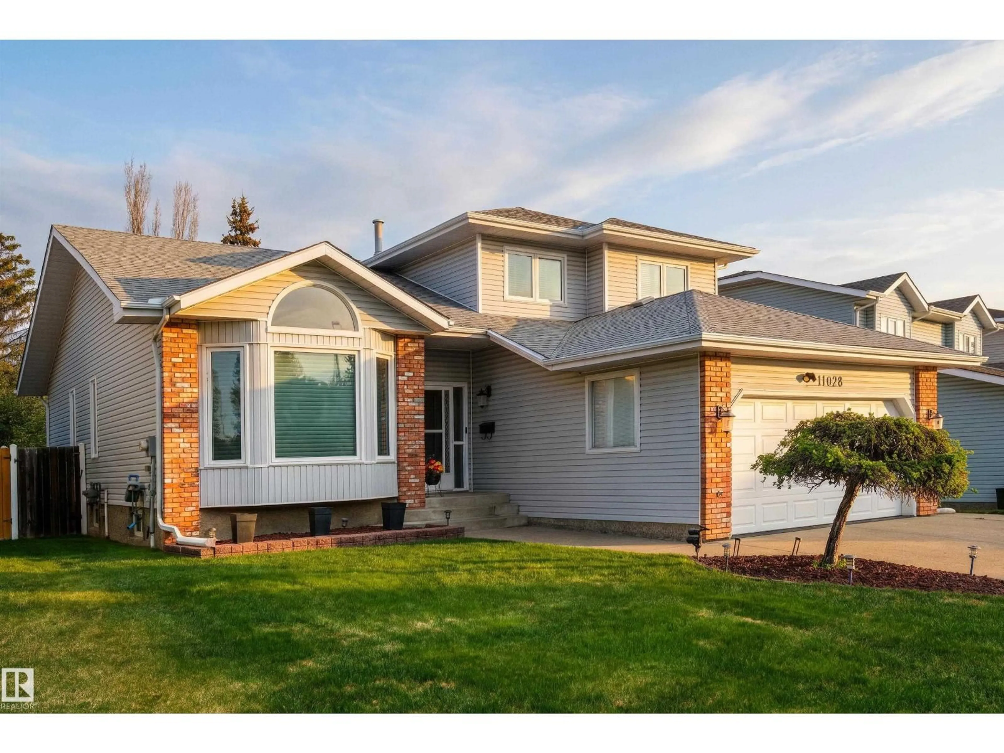 Home with vinyl exterior material, street for 11028 11 AV, Edmonton Alberta T6J6M9