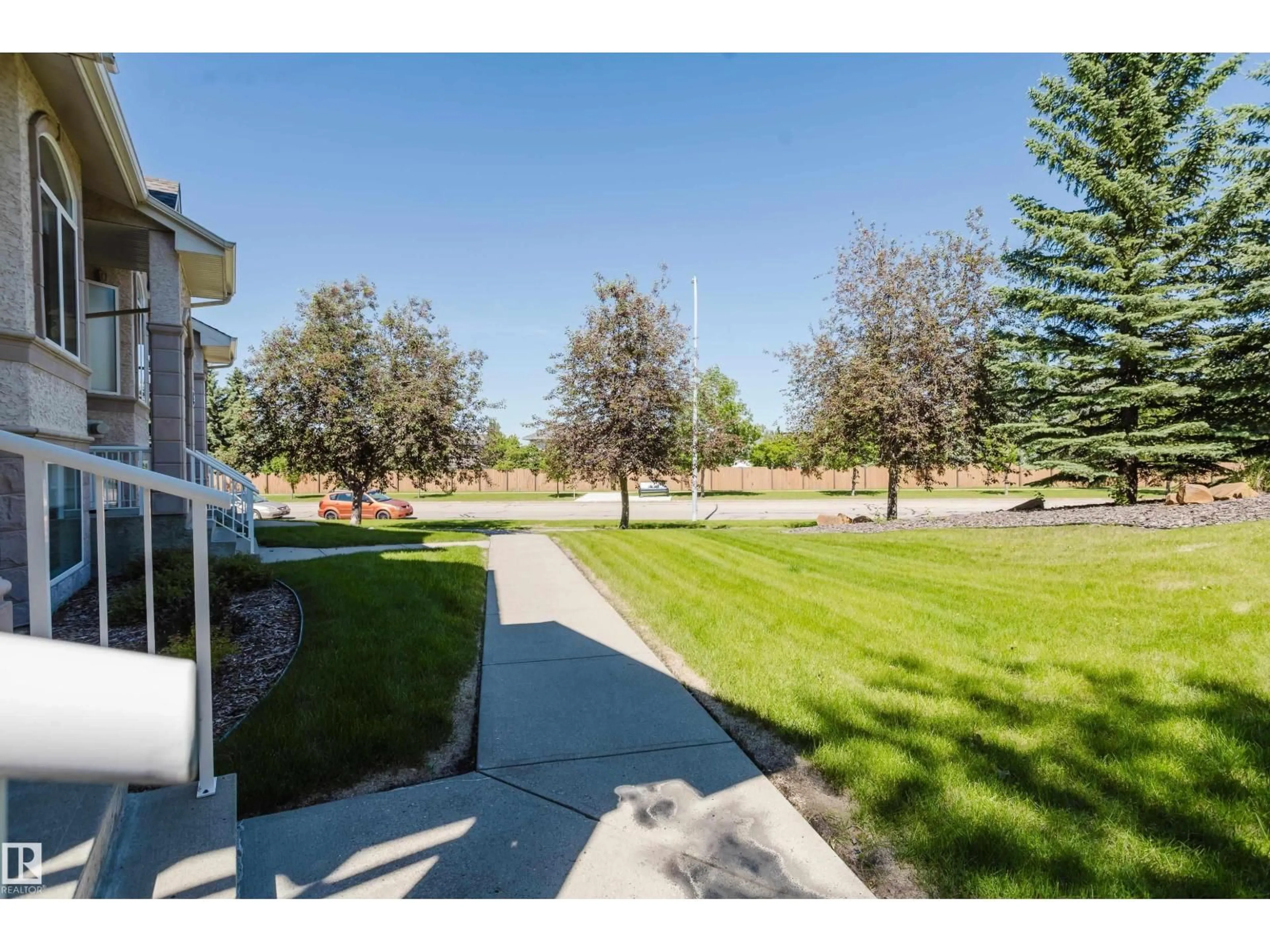 A pic from outside/outdoor area/front of a property/back of a property/a pic from drone, unknown for 101 - 30 JIM COMMON DR, Sherwood Park Alberta T8H2R8