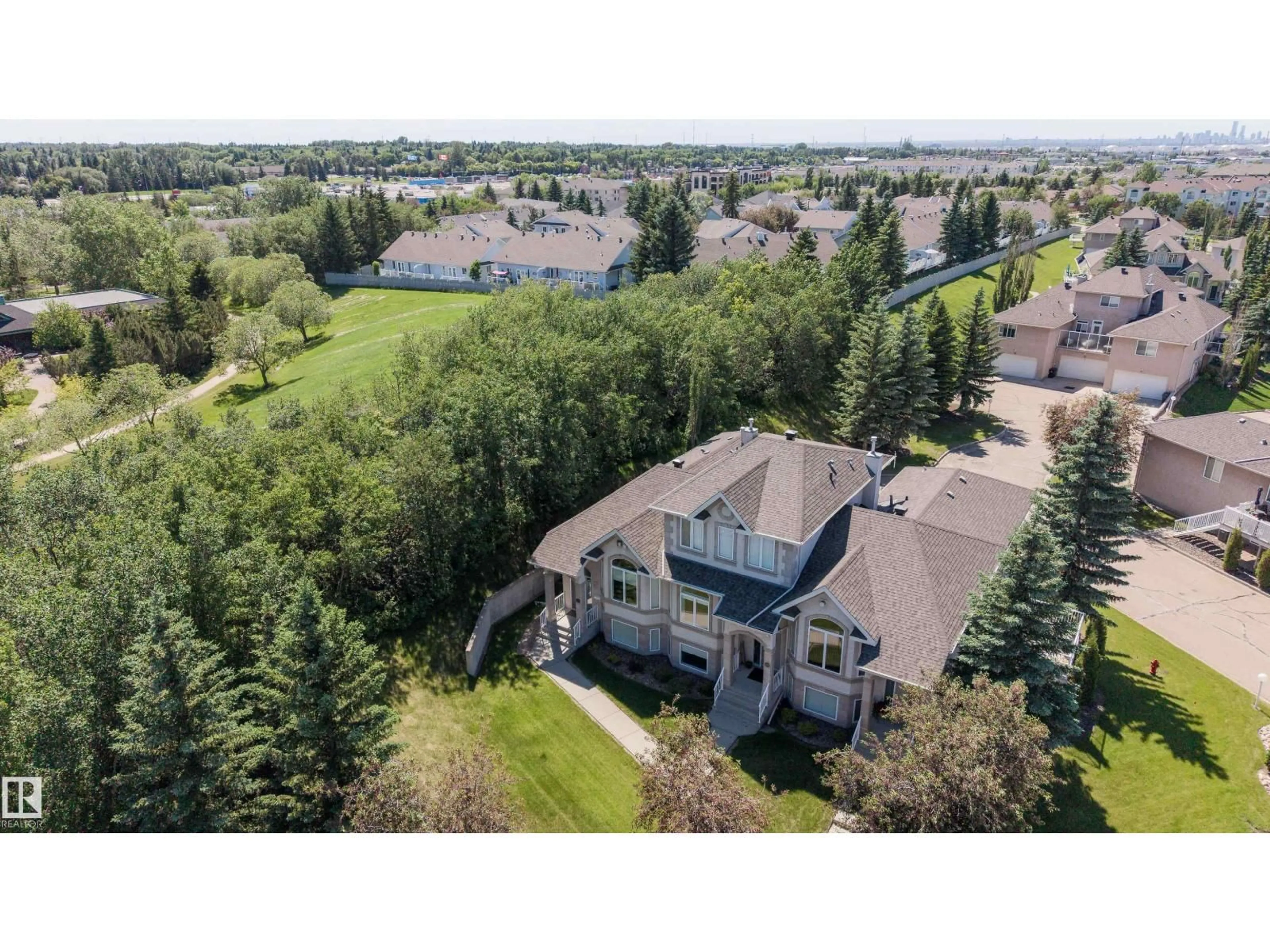 A pic from outside/outdoor area/front of a property/back of a property/a pic from drone, mountain view for 101 - 30 JIM COMMON DR, Sherwood Park Alberta T8H2R8