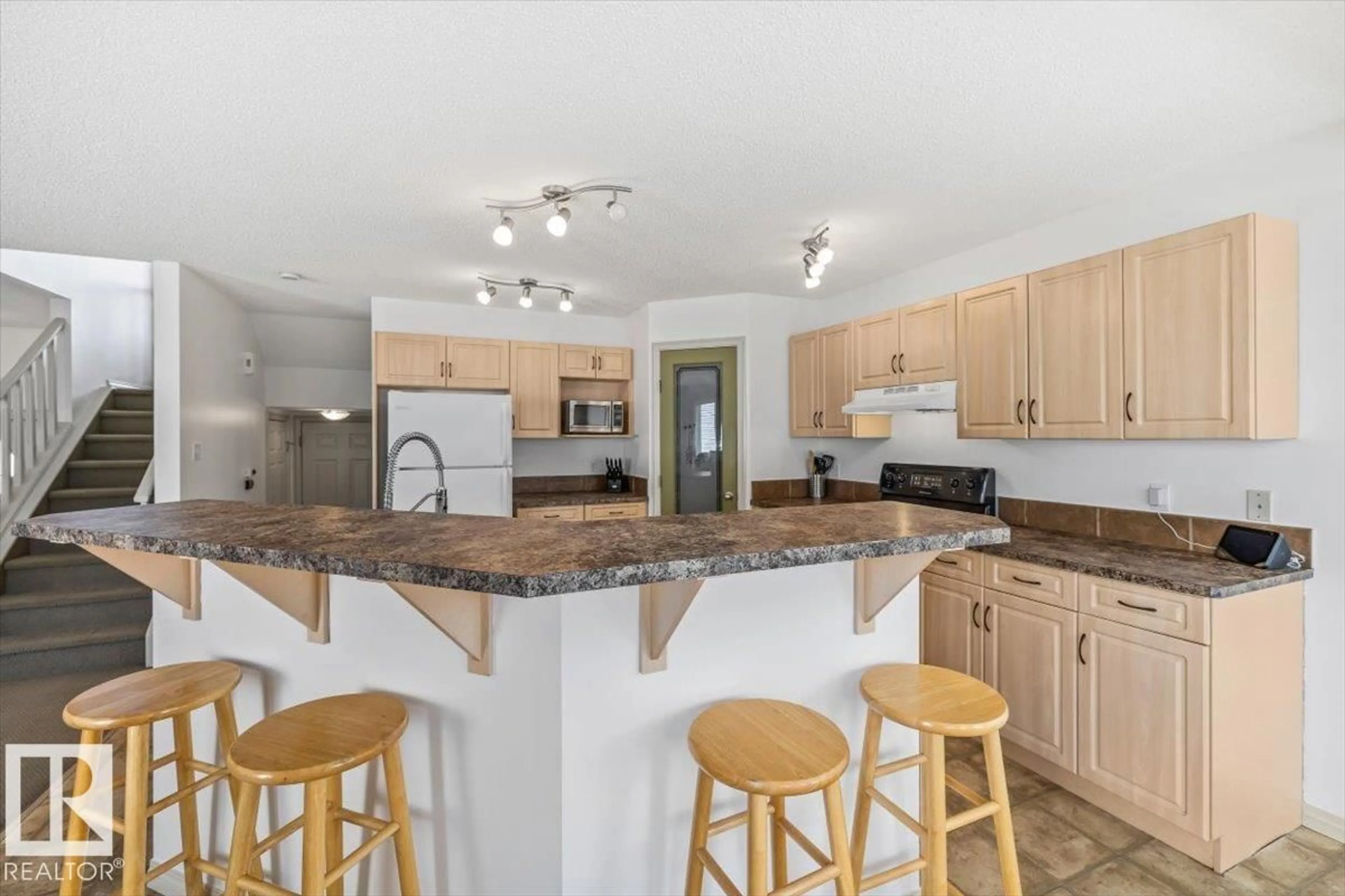 Open concept kitchen, ceramic/tile floor for 8509 7 AV, Edmonton Alberta T6X1J2