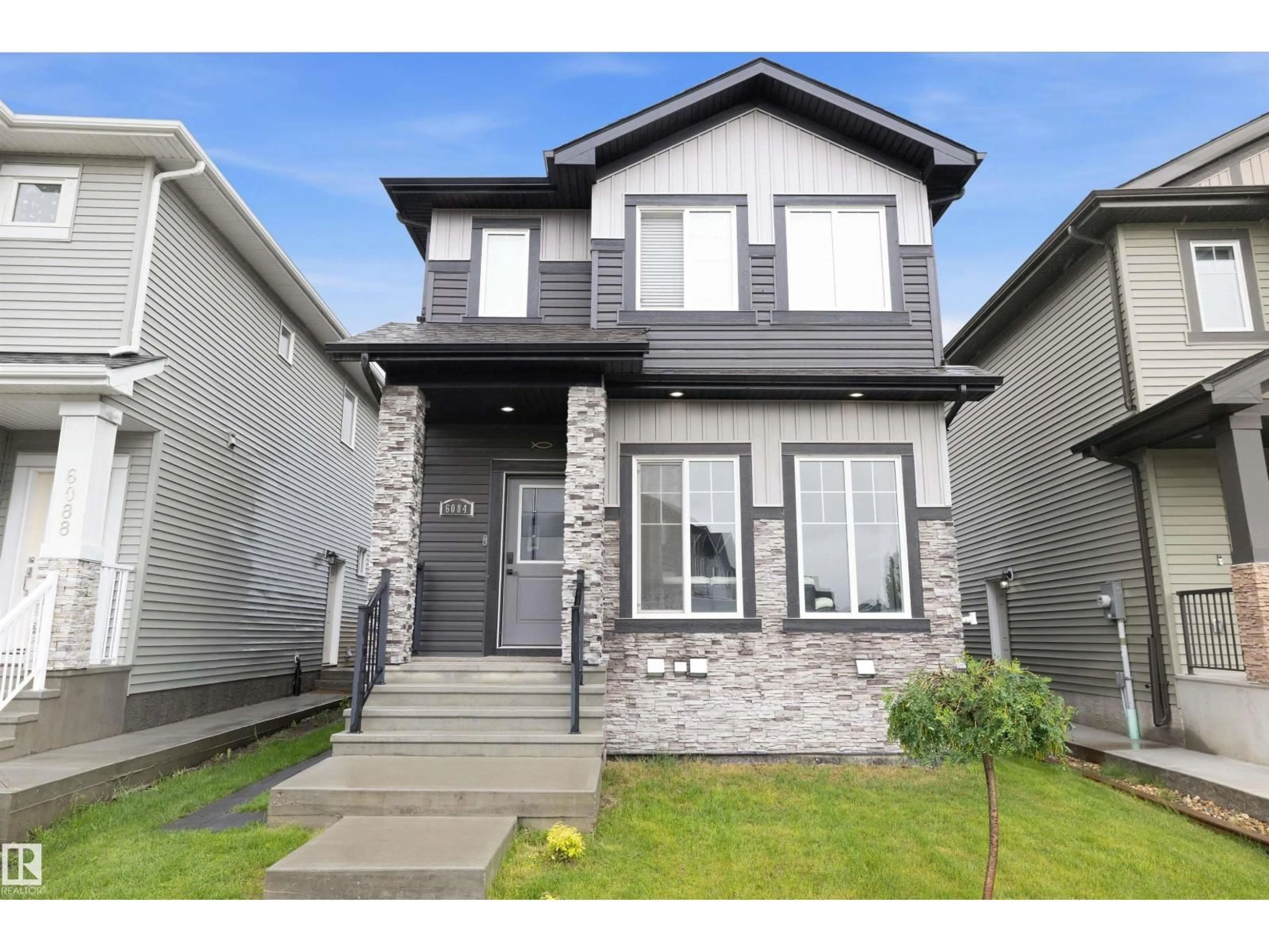 Home with vinyl exterior material, street for 6084 179 AV, Edmonton Alberta T5Y3X1