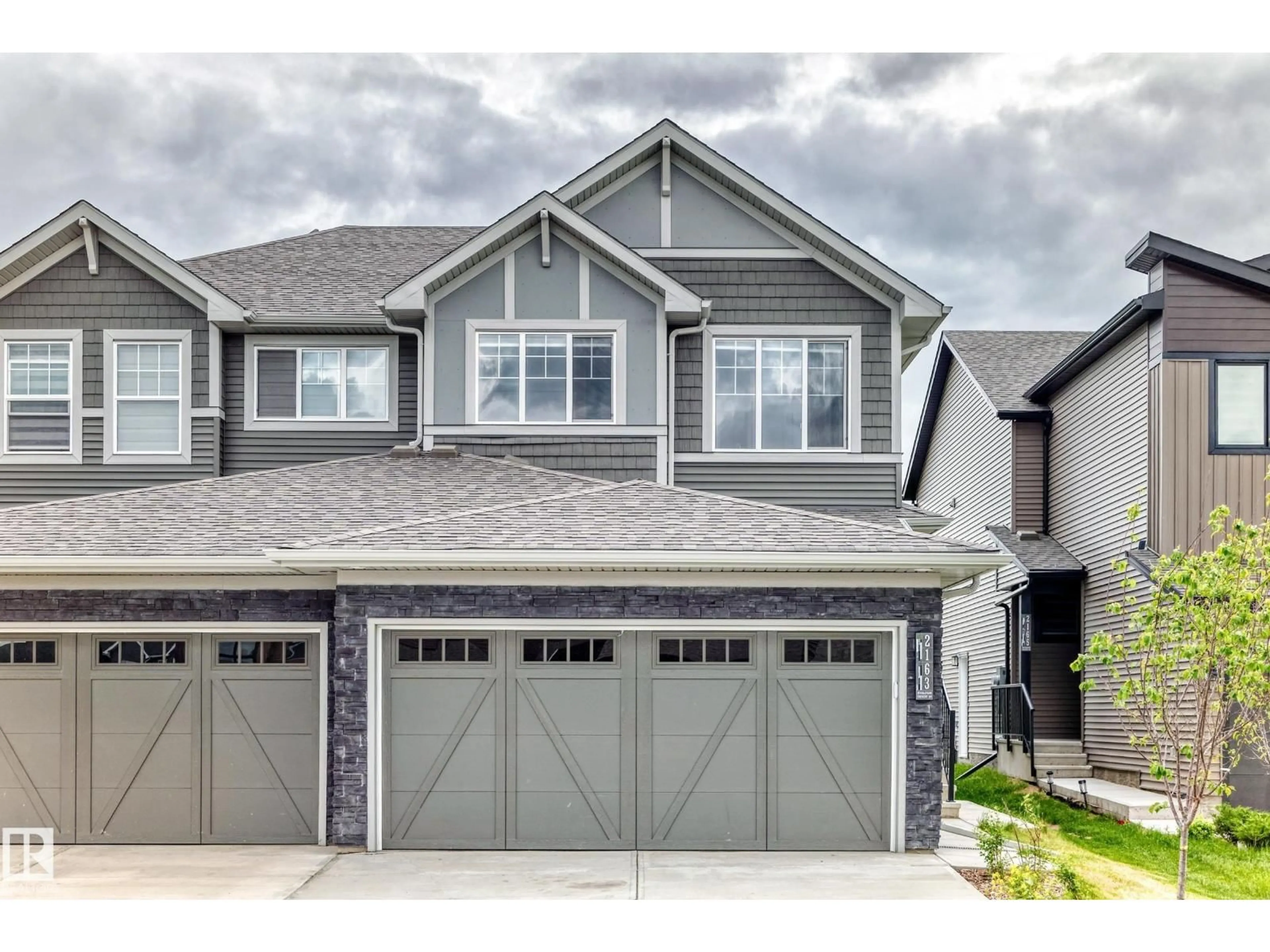 Home with vinyl exterior material, street for SW - 2163 MUCKLEPLUM CR, Edmonton Alberta T6X3G9