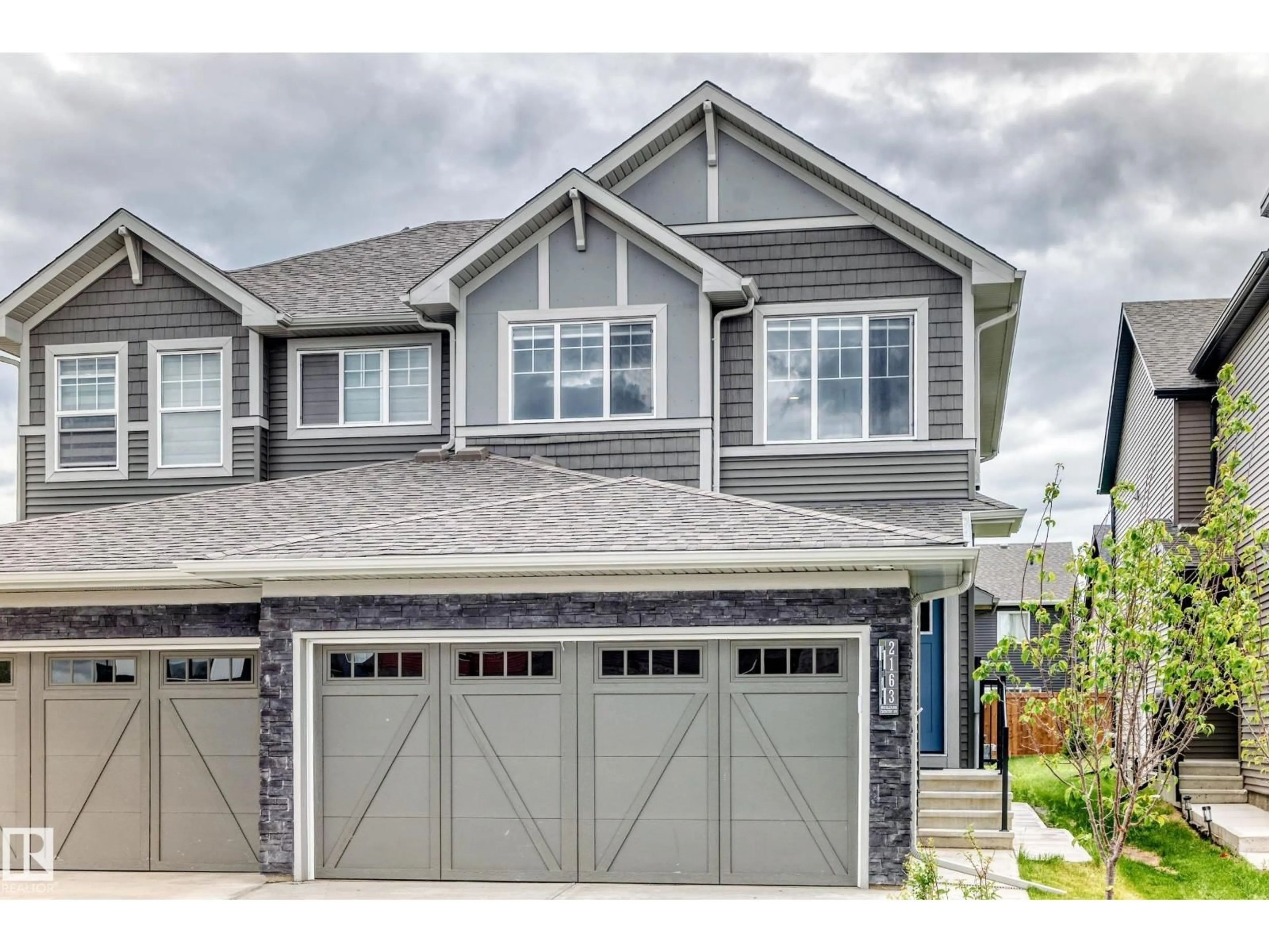 Home with vinyl exterior material, street for SW - 2163 MUCKLEPLUM CR, Edmonton Alberta T6X3G9