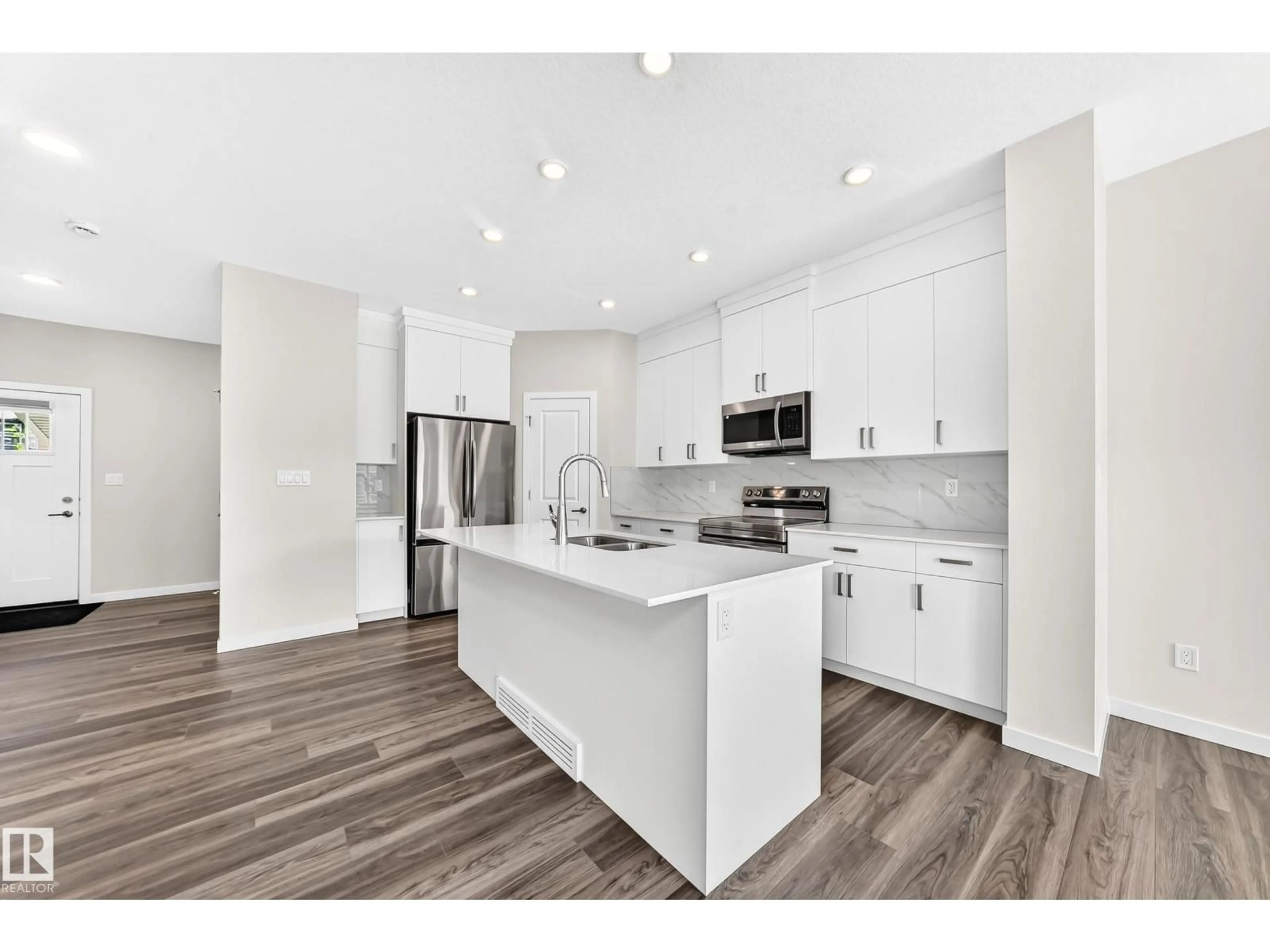 Open concept kitchen, unknown for SW - 2163 MUCKLEPLUM CR, Edmonton Alberta T6X3G9