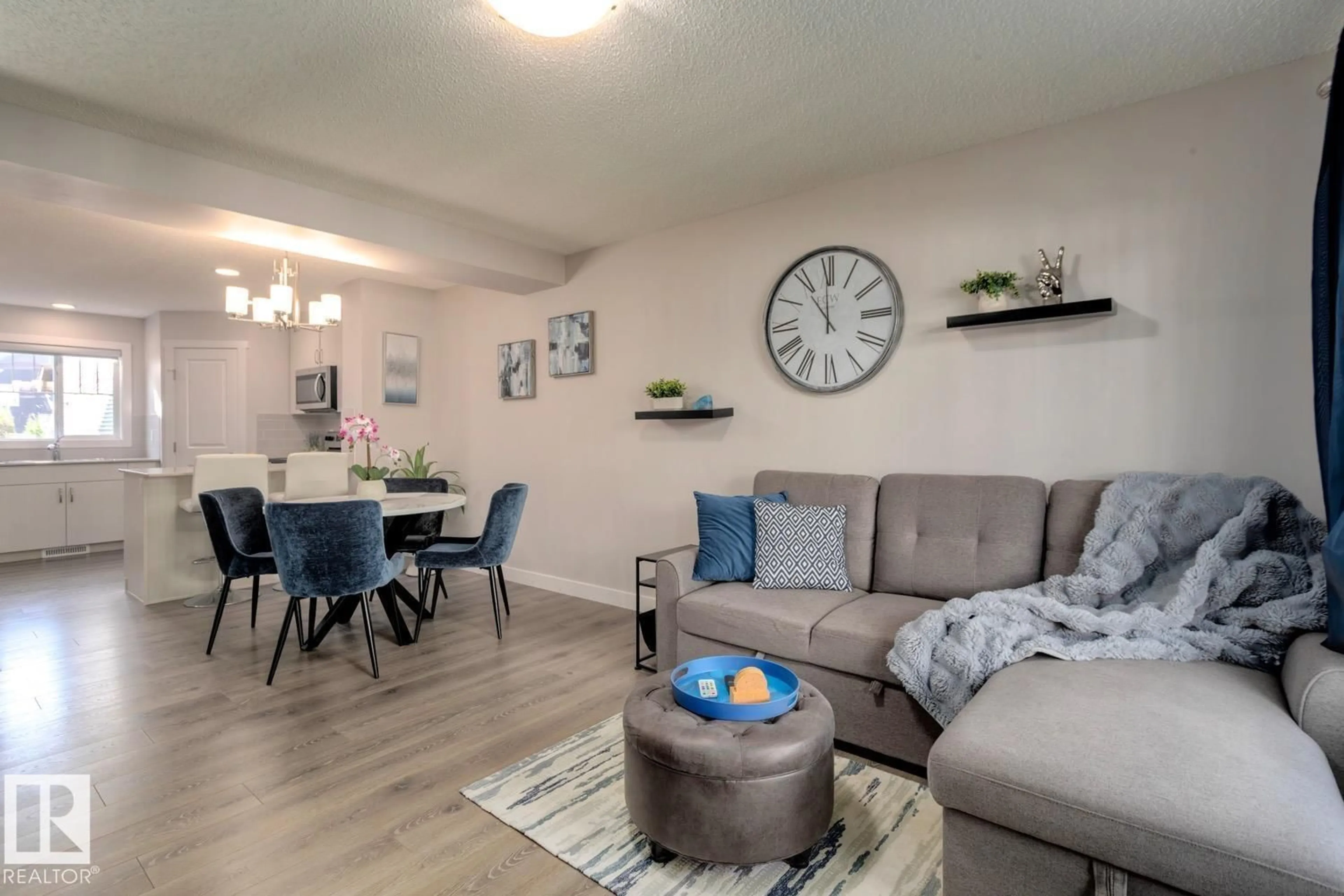 Living room with furniture, wood/laminate floor for 72 - 1005 GRAYDON HILL BV, Edmonton Alberta T6W3J5