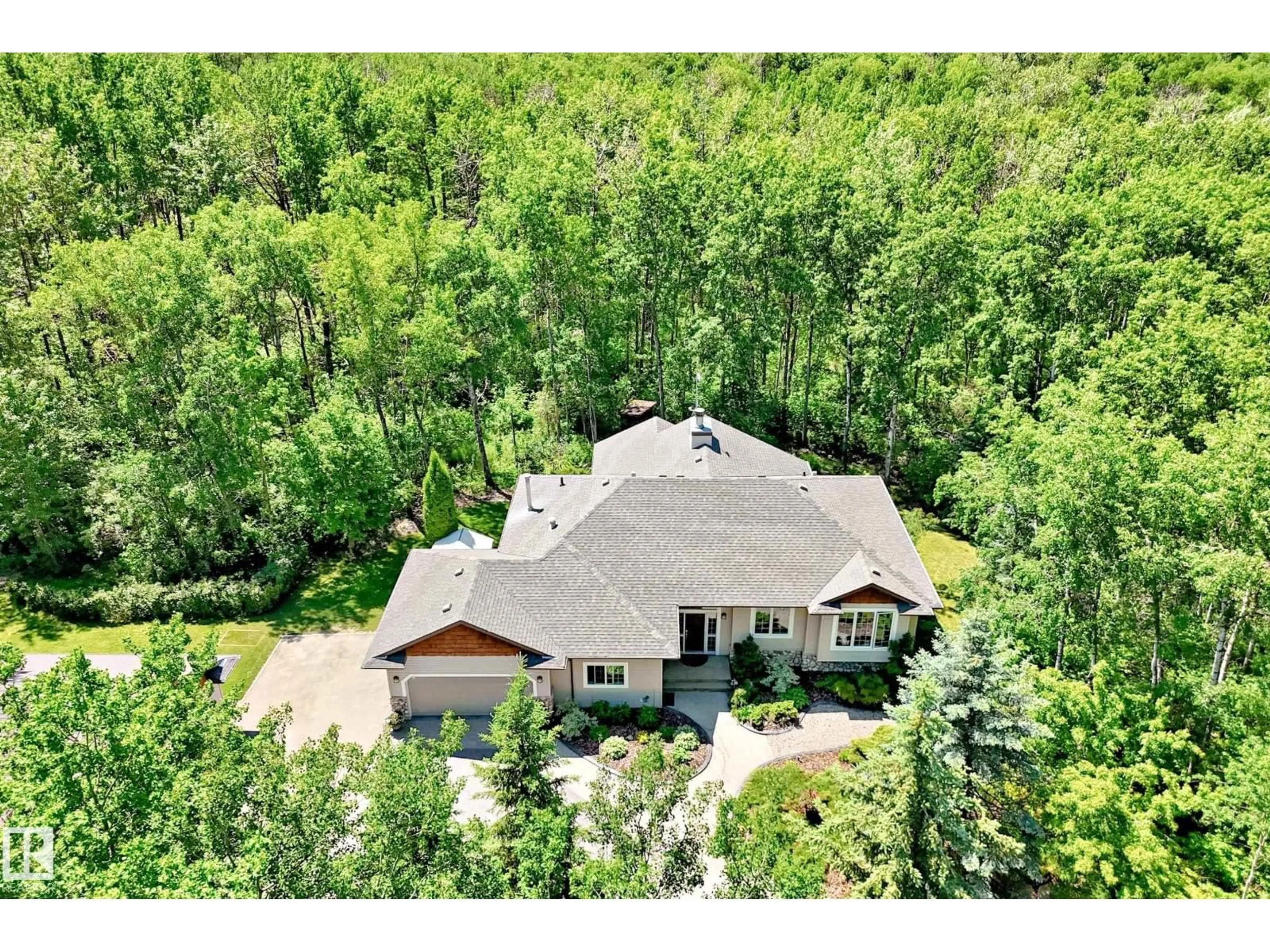 A pic from outside/outdoor area/front of a property/back of a property/a pic from drone, mountain view for 133 52465 RGE ROAD 213, Rural Strathcona County Alberta T8G2E8