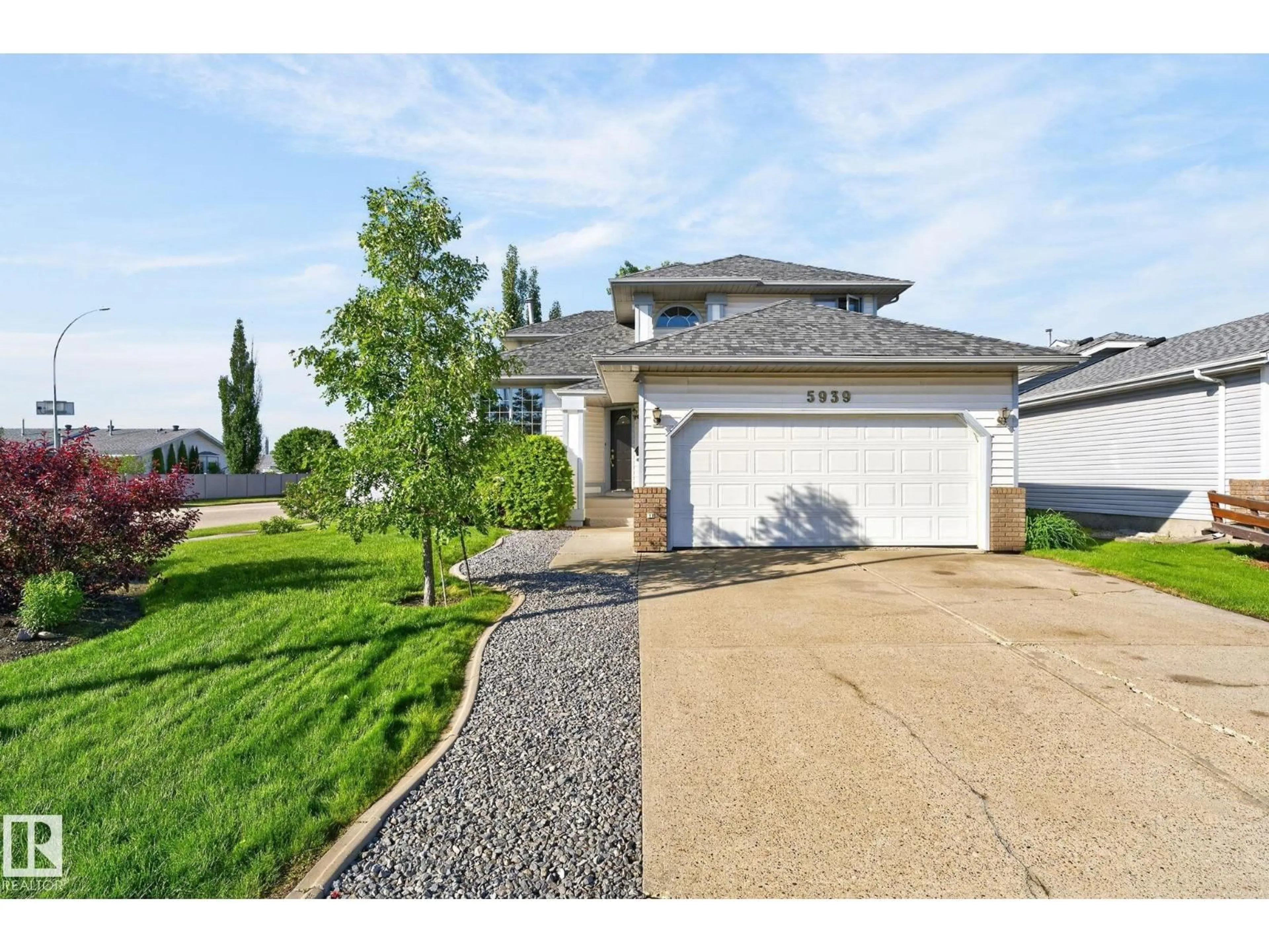 Home with vinyl exterior material, street for 5939 157 AV, Edmonton Alberta T5Y2M8