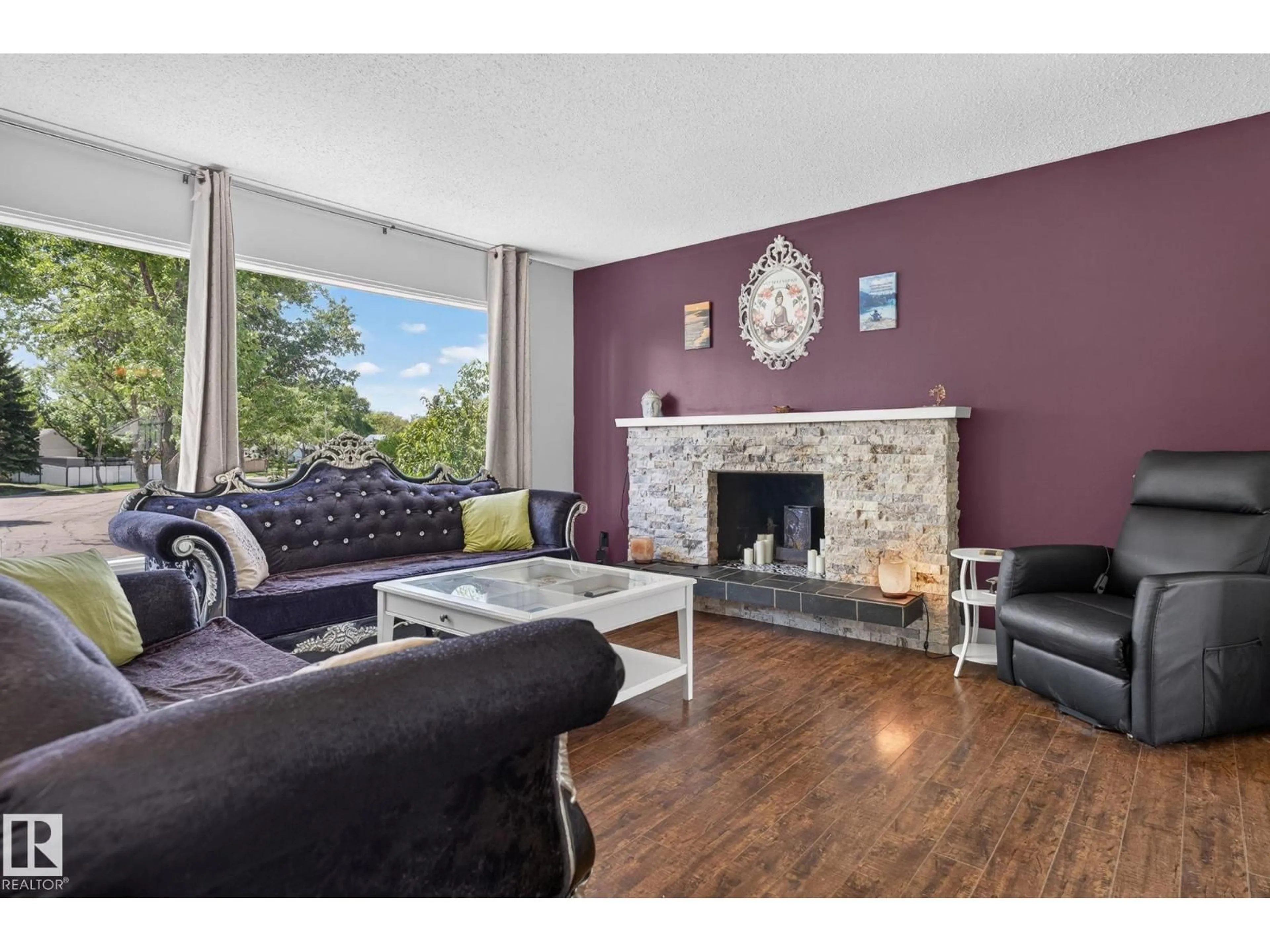 Living room with furniture, wood/laminate floor for 8517 95 B AV, Fort Saskatchewan Alberta T8L2V7