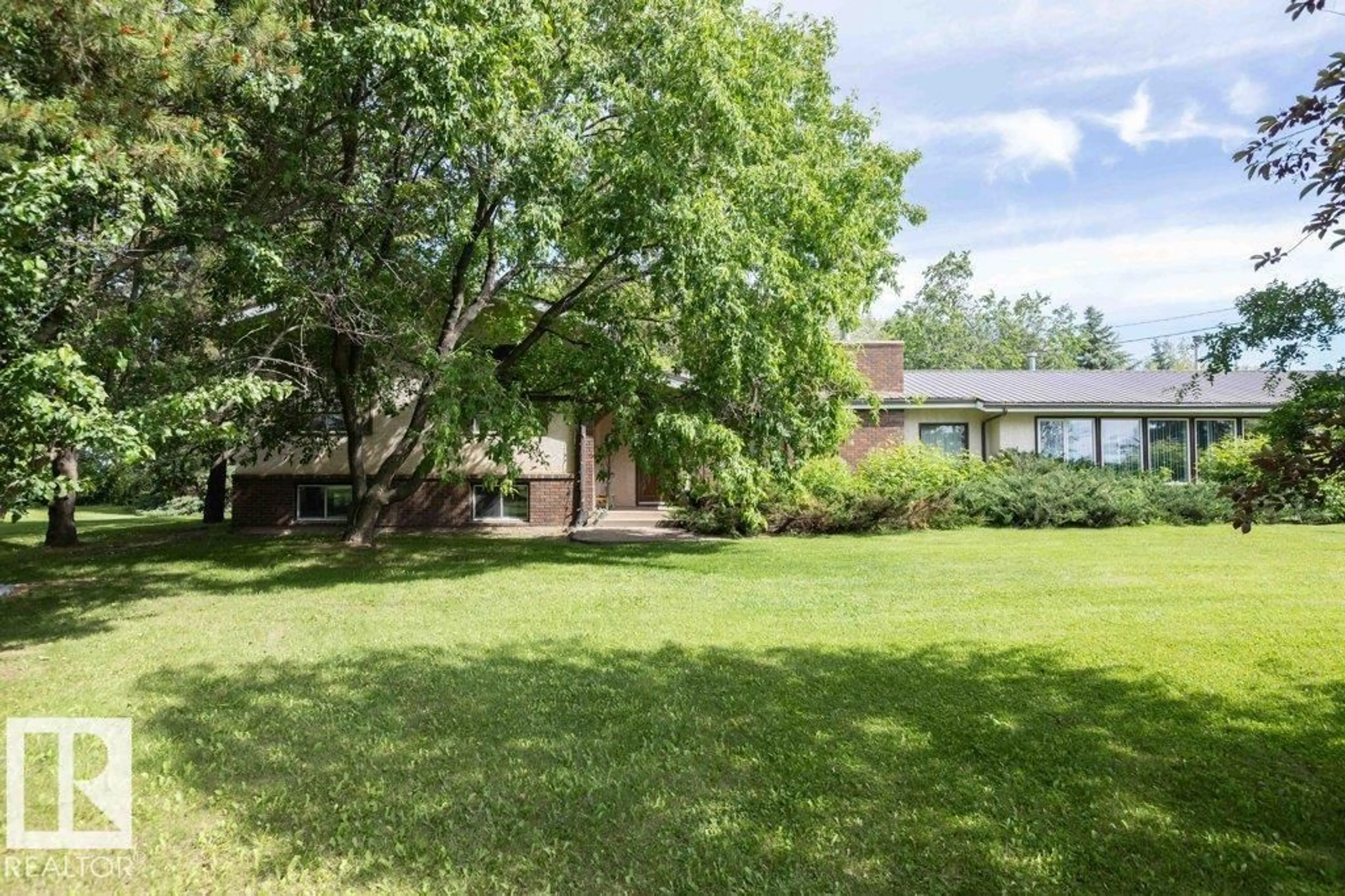 A pic from outside/outdoor area/front of a property/back of a property/a pic from drone, water/lake/river/ocean view for 26530 TWP RD 590, Rural Westlock County Alberta T0G1W0