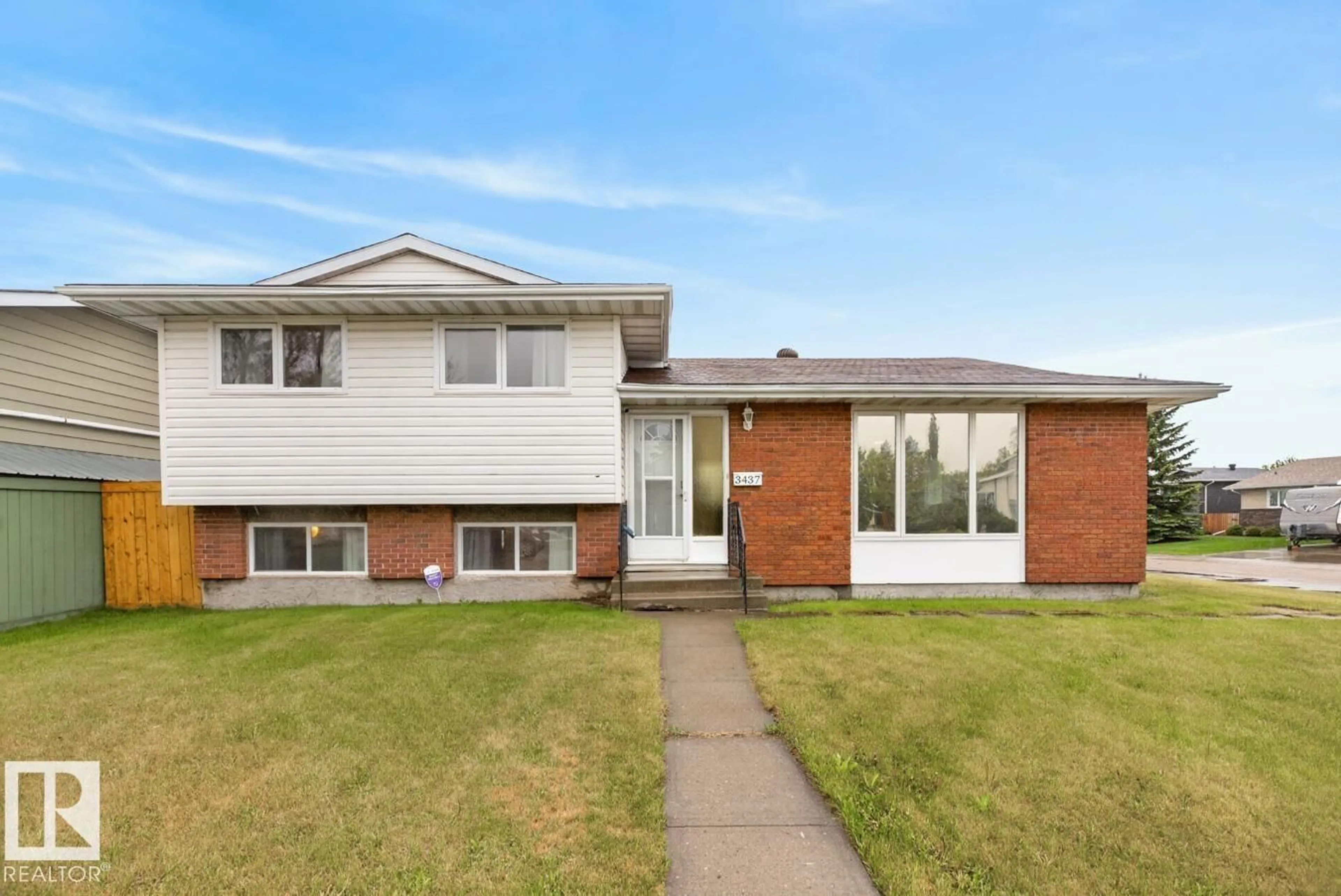 Home with brick exterior material, street for 3437 136A AV, Edmonton Alberta T5A2W5