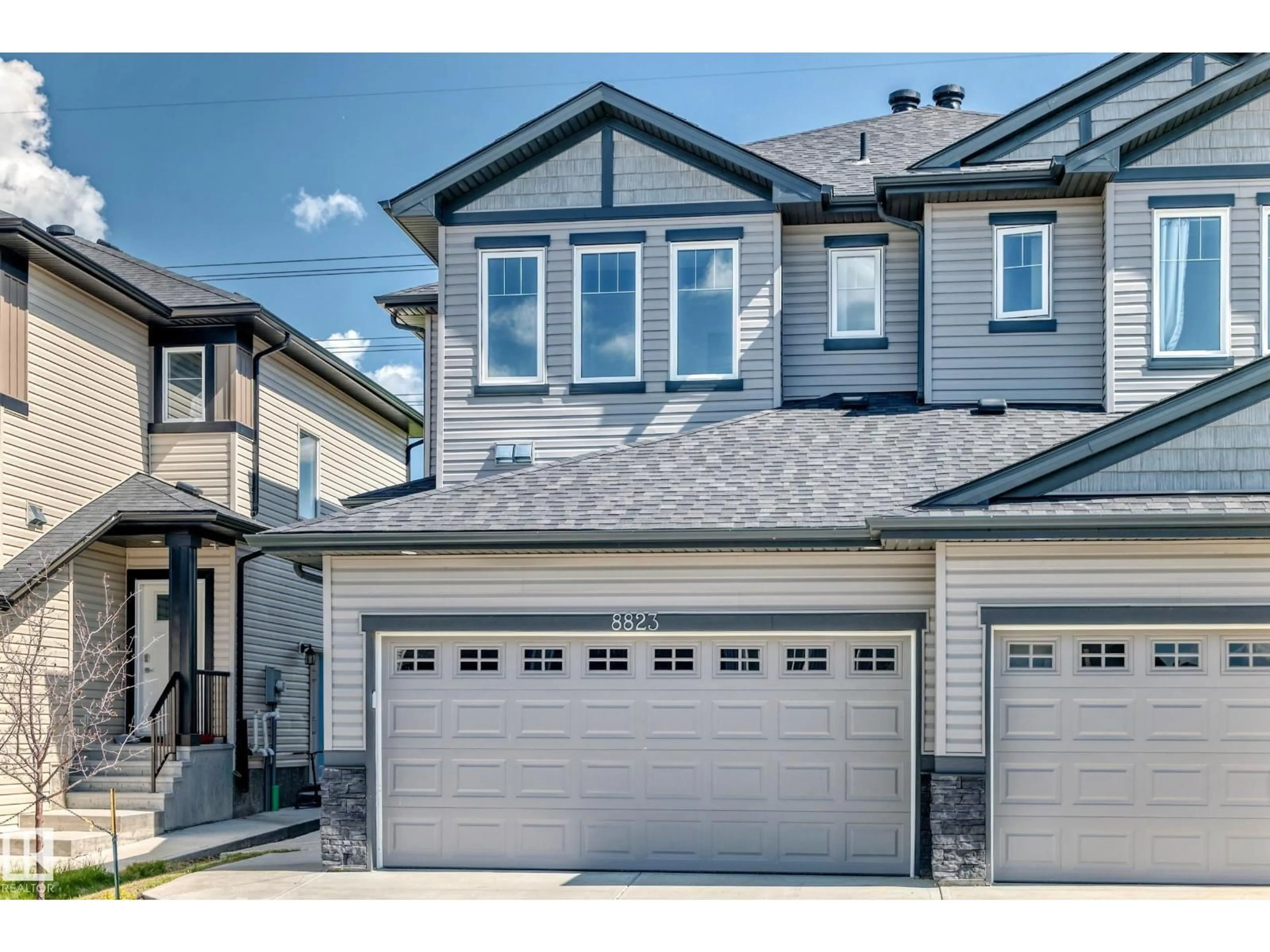 Home with vinyl exterior material, street for 8823 CARSON WY, Edmonton Alberta T6W4M9