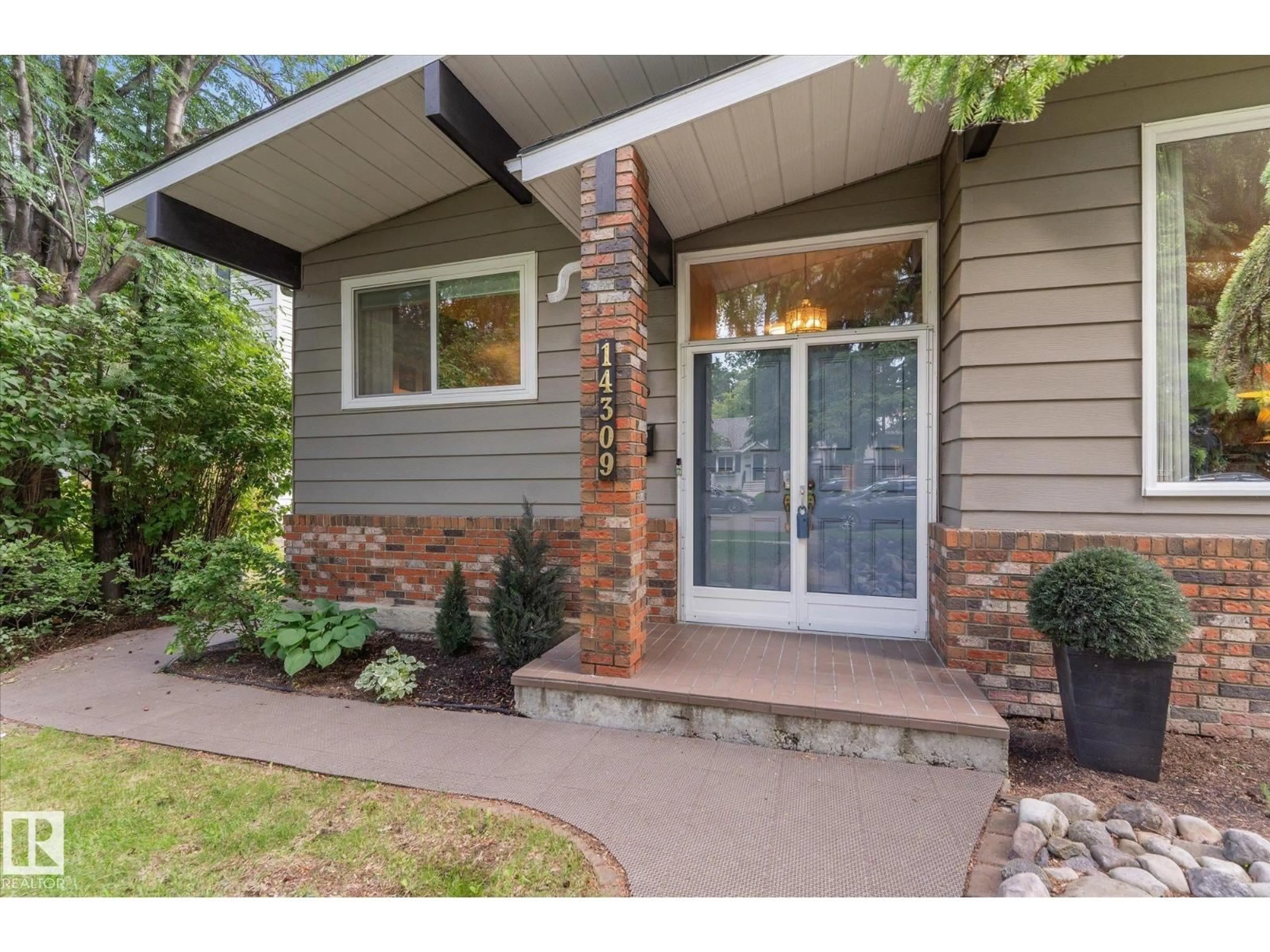 Home with brick exterior material, street for NW - 14309 101 AV, Edmonton Alberta T5N0K7