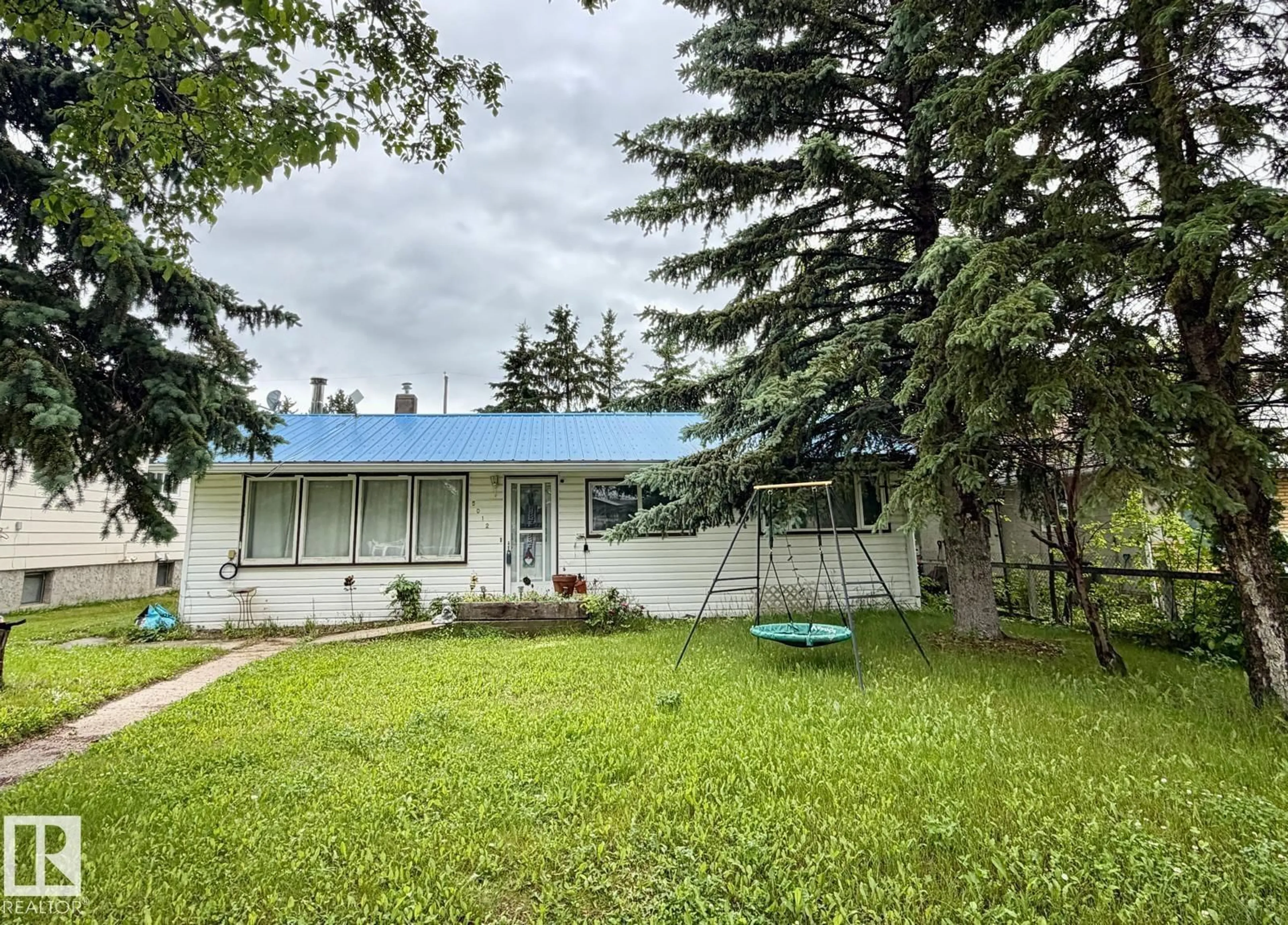 A pic from outside/outdoor area/front of a property/back of a property/a pic from drone, street for 5012 48 STREET, Warburg Alberta T0C2T0