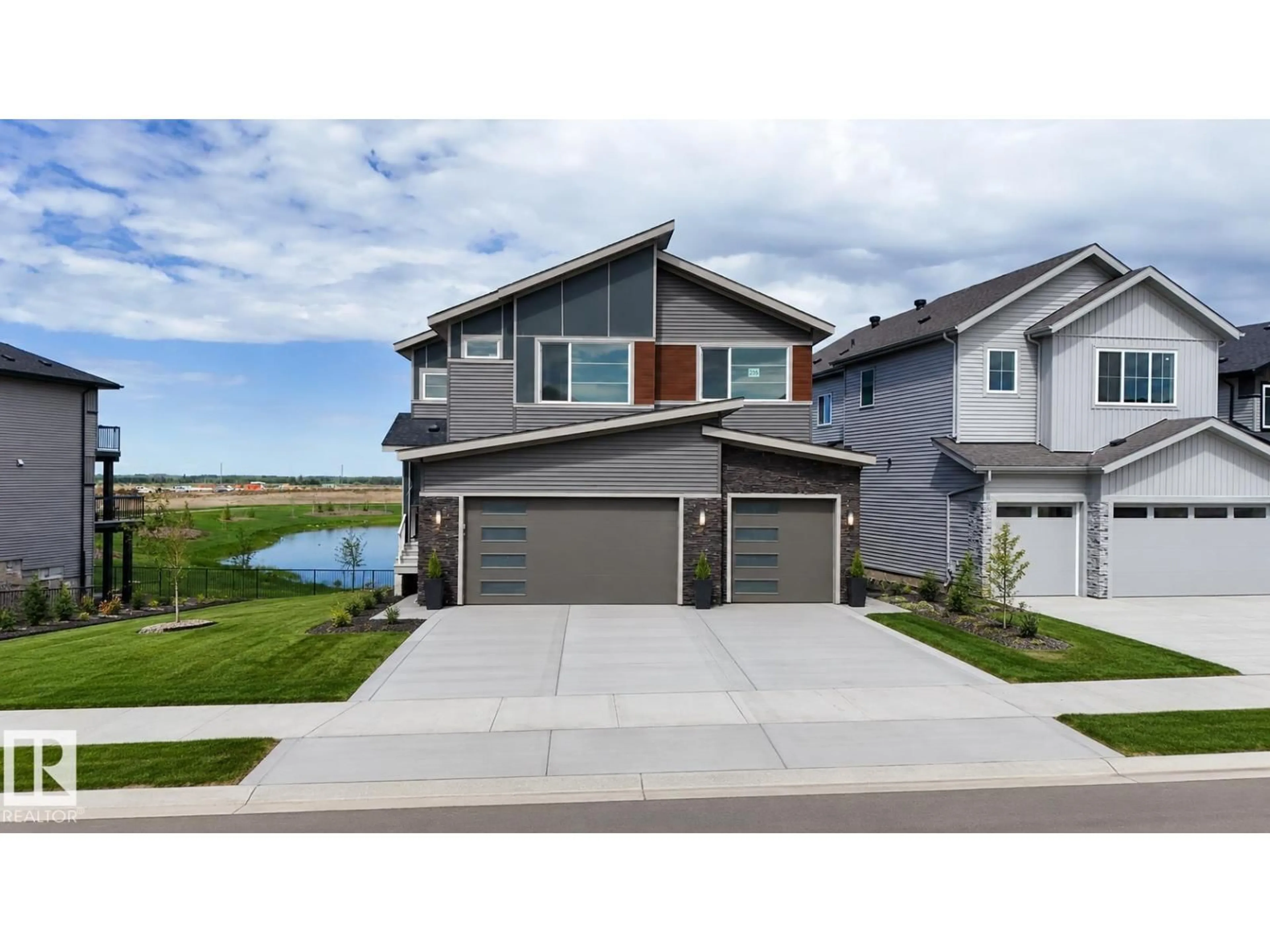 Home with vinyl exterior material, street for 235 CRYSTAL CREEK DR, Leduc Alberta T9E0X6