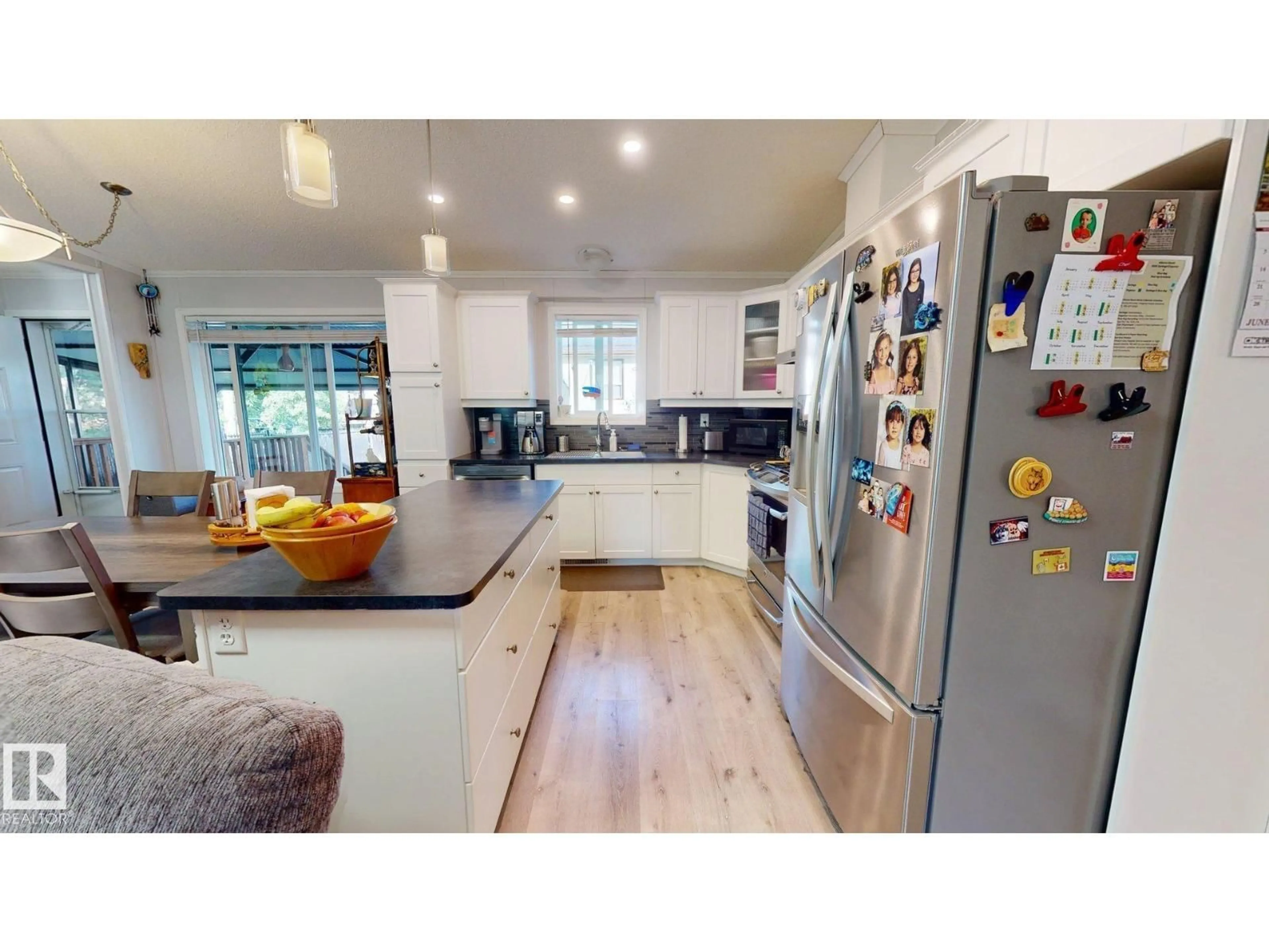 Contemporary kitchen, wood/laminate floor for 4707 52A ST, Rural Lac Ste. Anne County Alberta T0E0A0