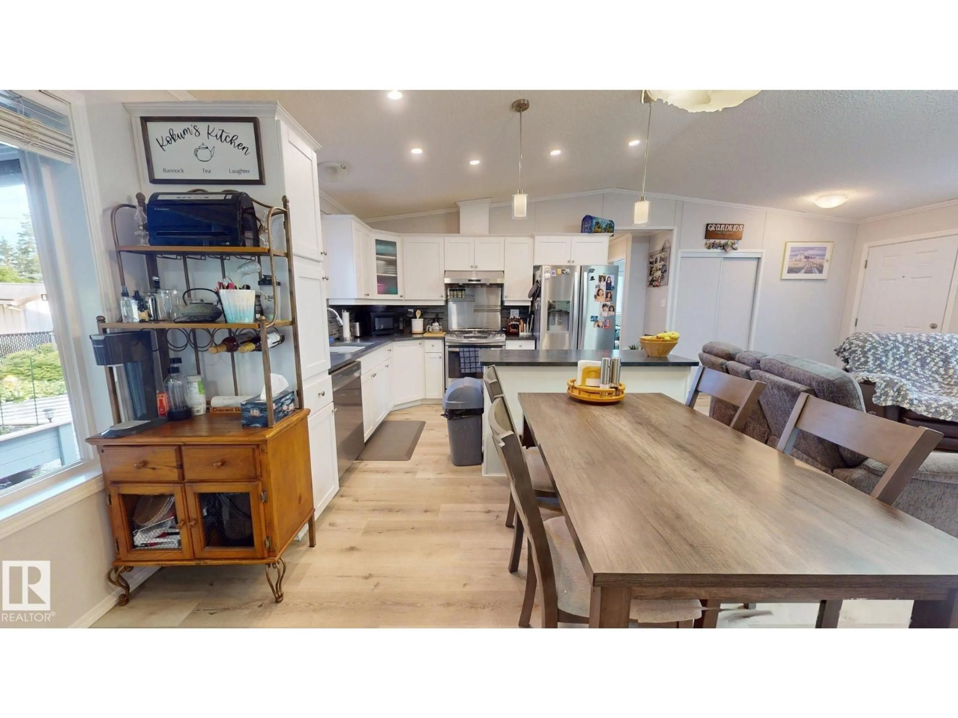 Open concept kitchen, wood/laminate floor for 4707 52A ST, Rural Lac Ste. Anne County Alberta T0E0A0