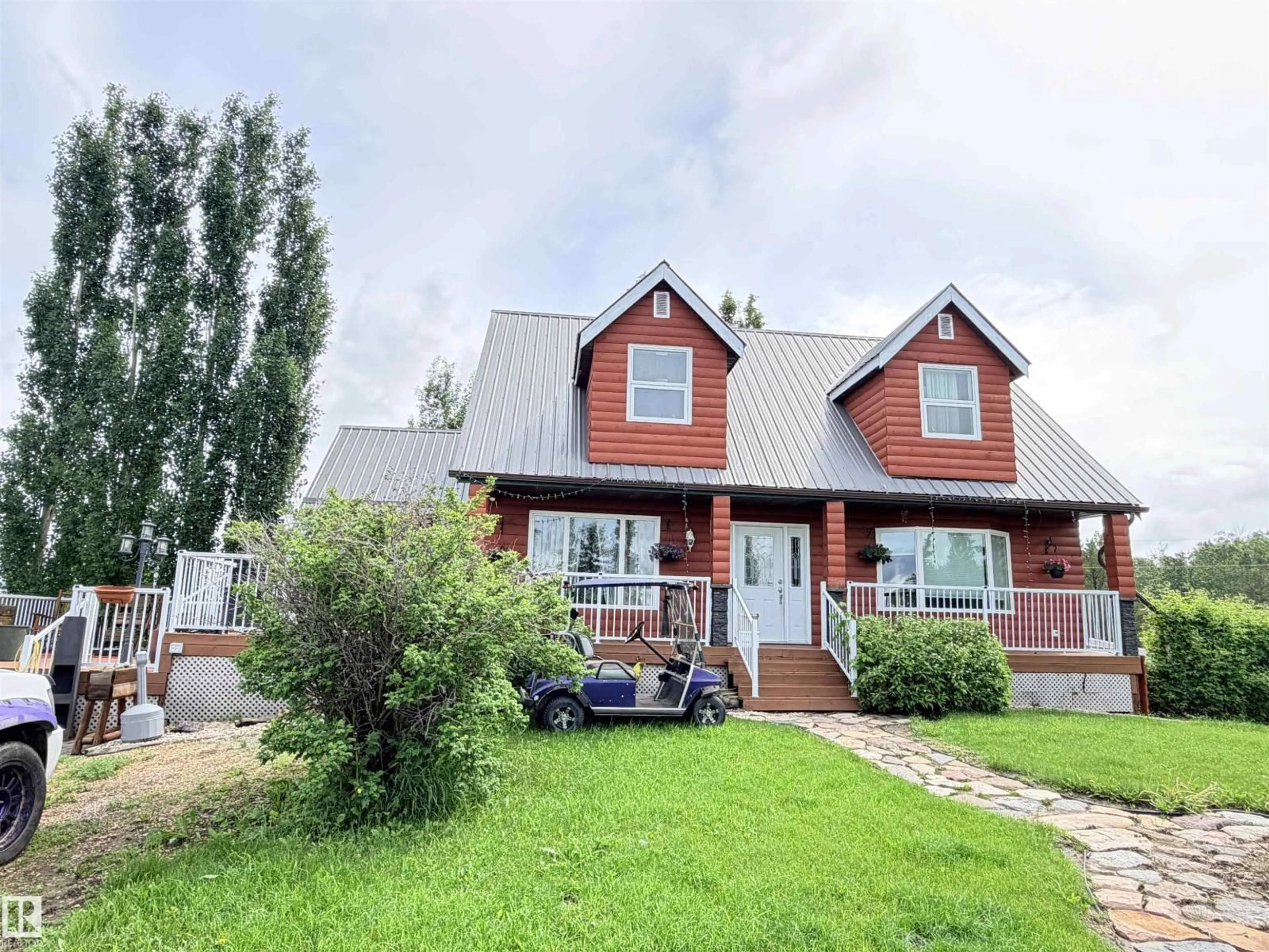 Home with vinyl exterior material, street for 26418 TWP RD 633, Rural Westlock County Alberta T0G1H0