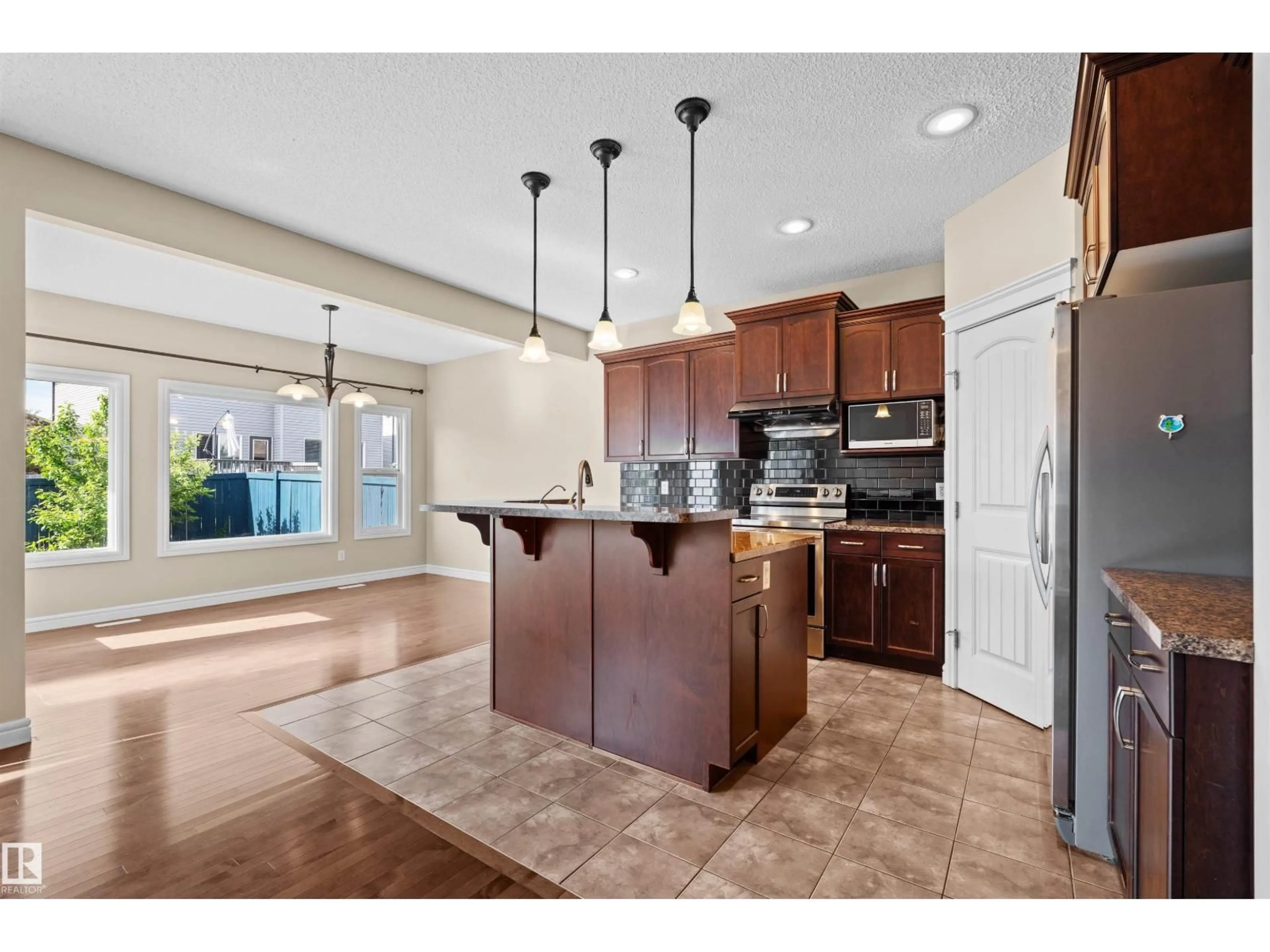 Open concept kitchen, ceramic/tile floor for 11711 16 AVE SW, Edmonton Alberta T6W1M9