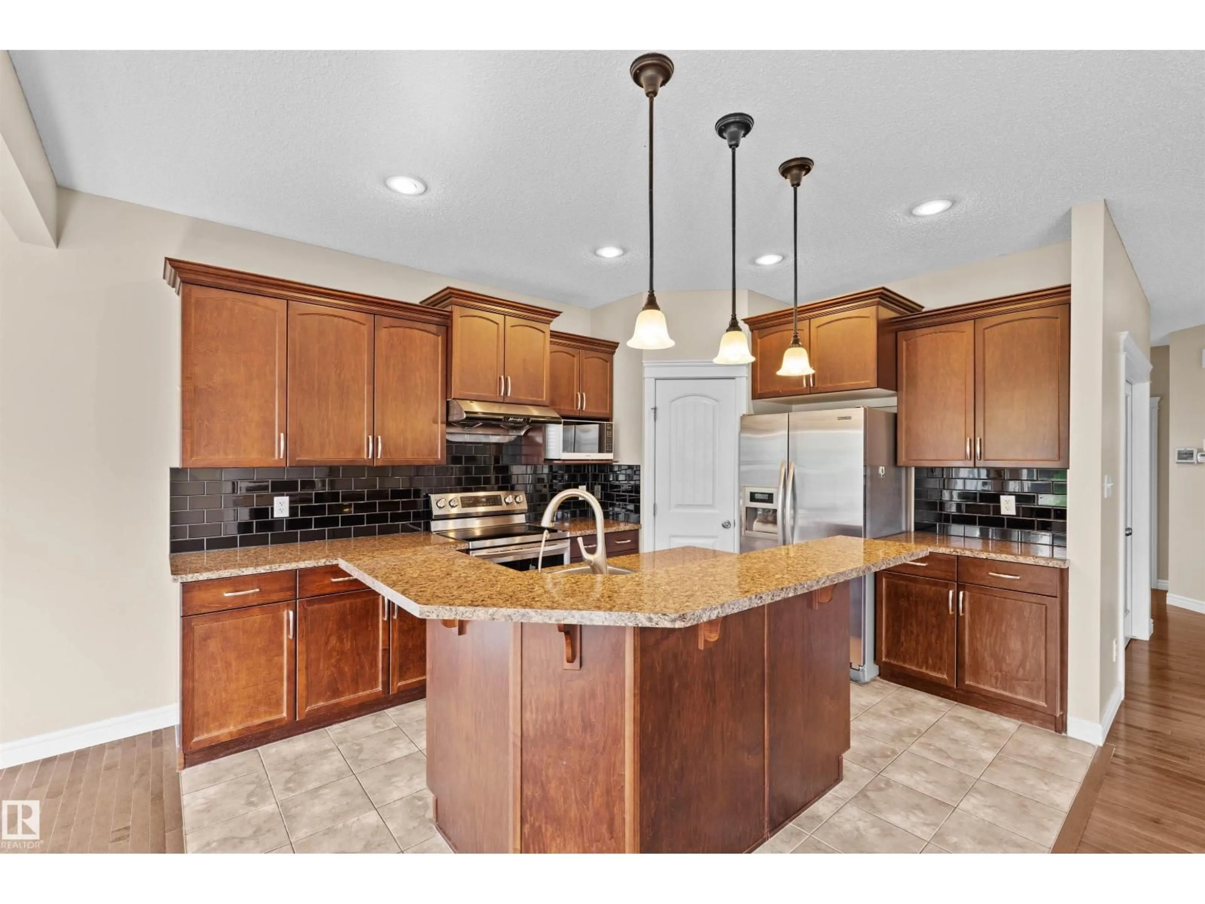 Open concept kitchen, ceramic/tile floor for 11711 16 AVE SW, Edmonton Alberta T6W1M9