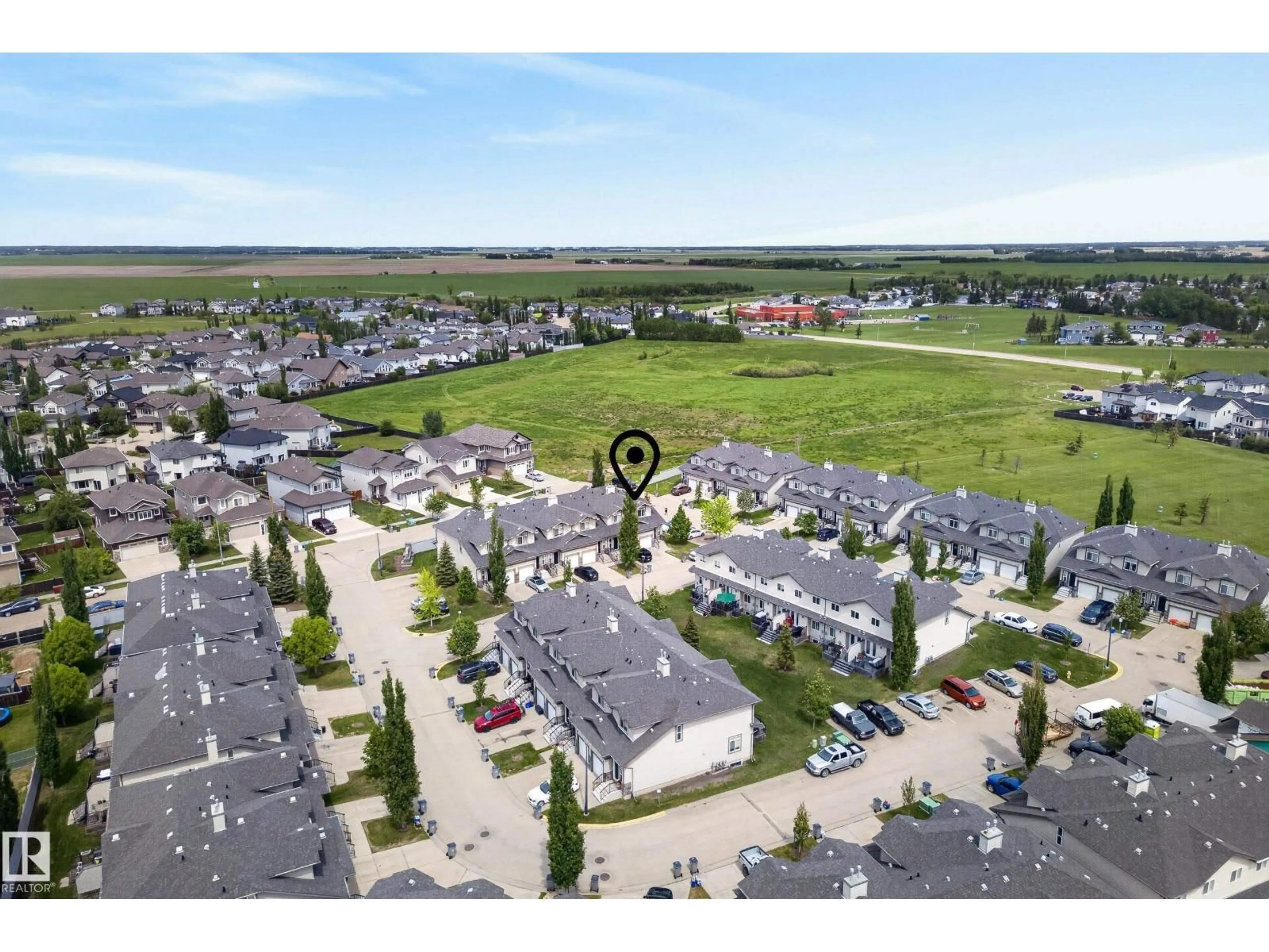 A pic from outside/outdoor area/front of a property/back of a property/a pic from drone, street for 51 - 9511 102 AV, Morinville Alberta T8R0C6