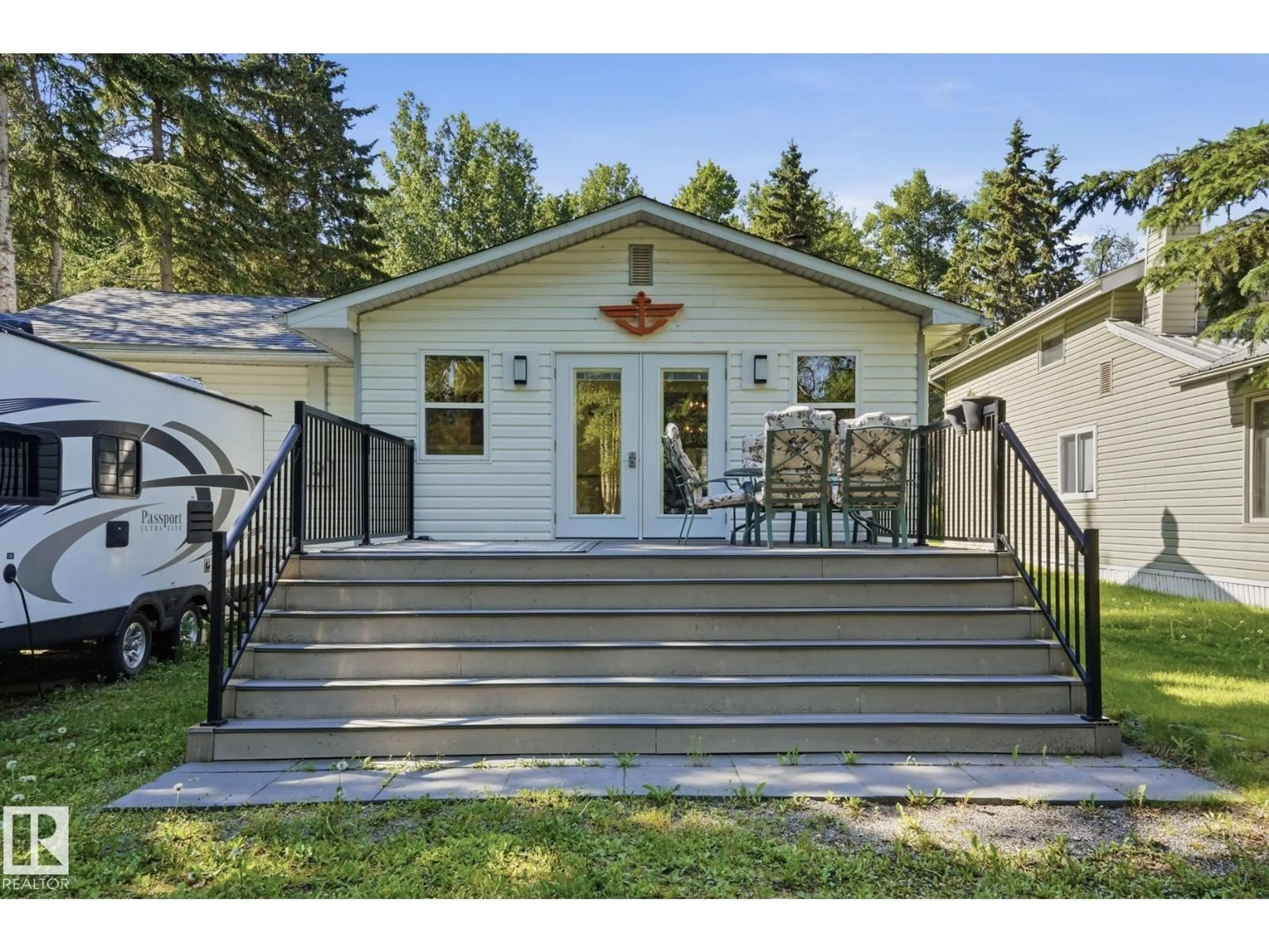 Home with vinyl exterior material, street for 1410 RANGE RD 15, Rural Leduc County Alberta T0C2P0