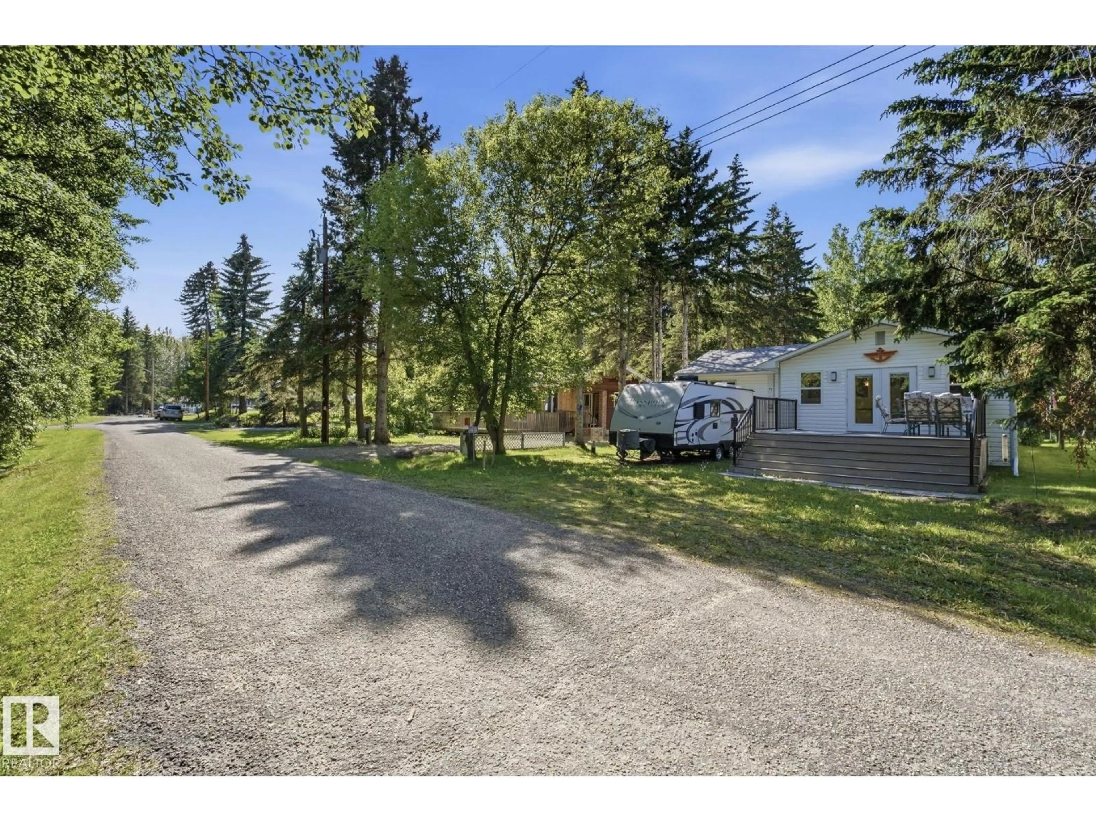 A pic from outside/outdoor area/front of a property/back of a property/a pic from drone, street for 1410 RANGE RD 15, Rural Leduc County Alberta T0C2P0