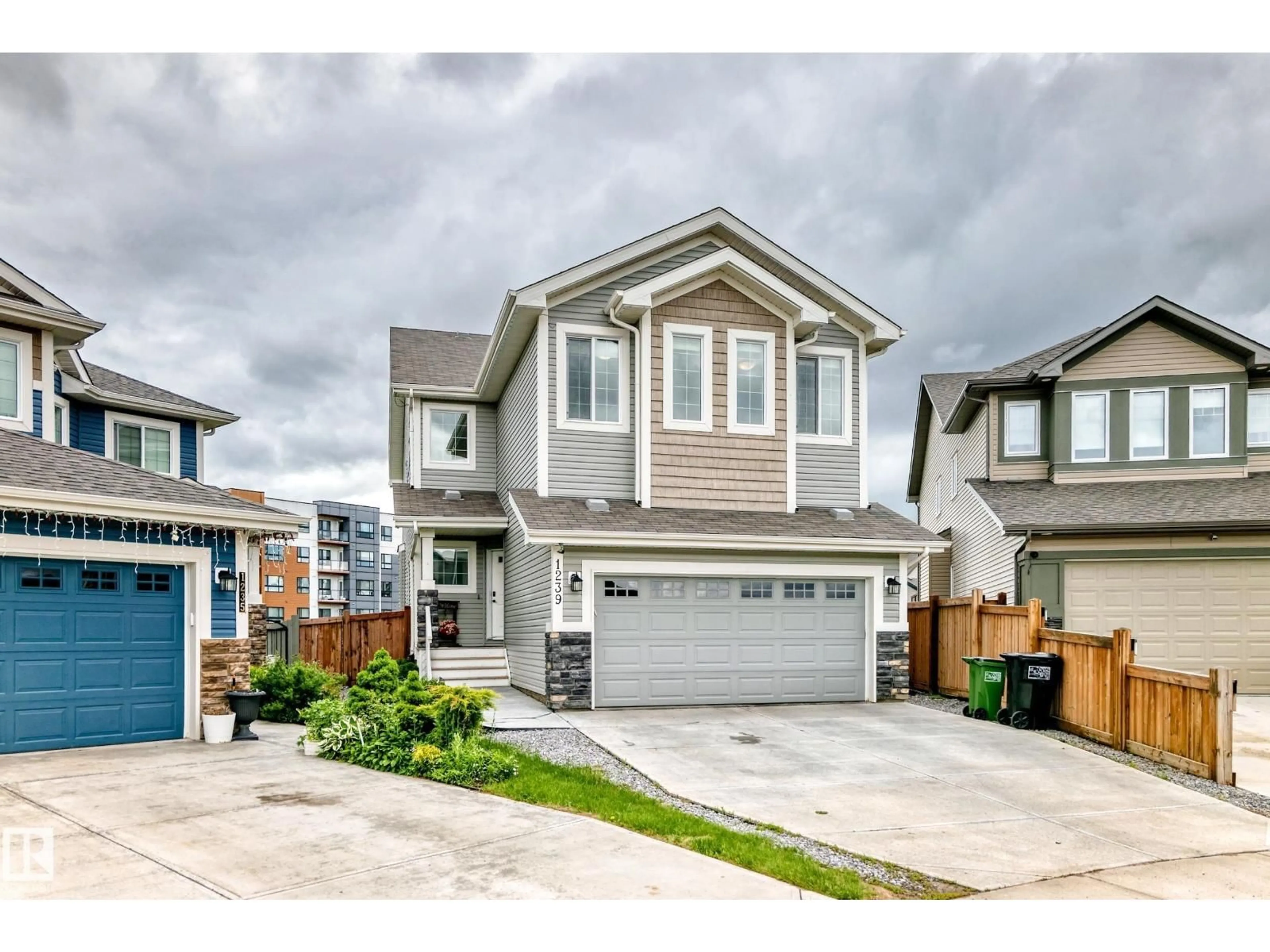 Home with vinyl exterior material, street for 1239 24 AV, Edmonton Alberta T6T2E4