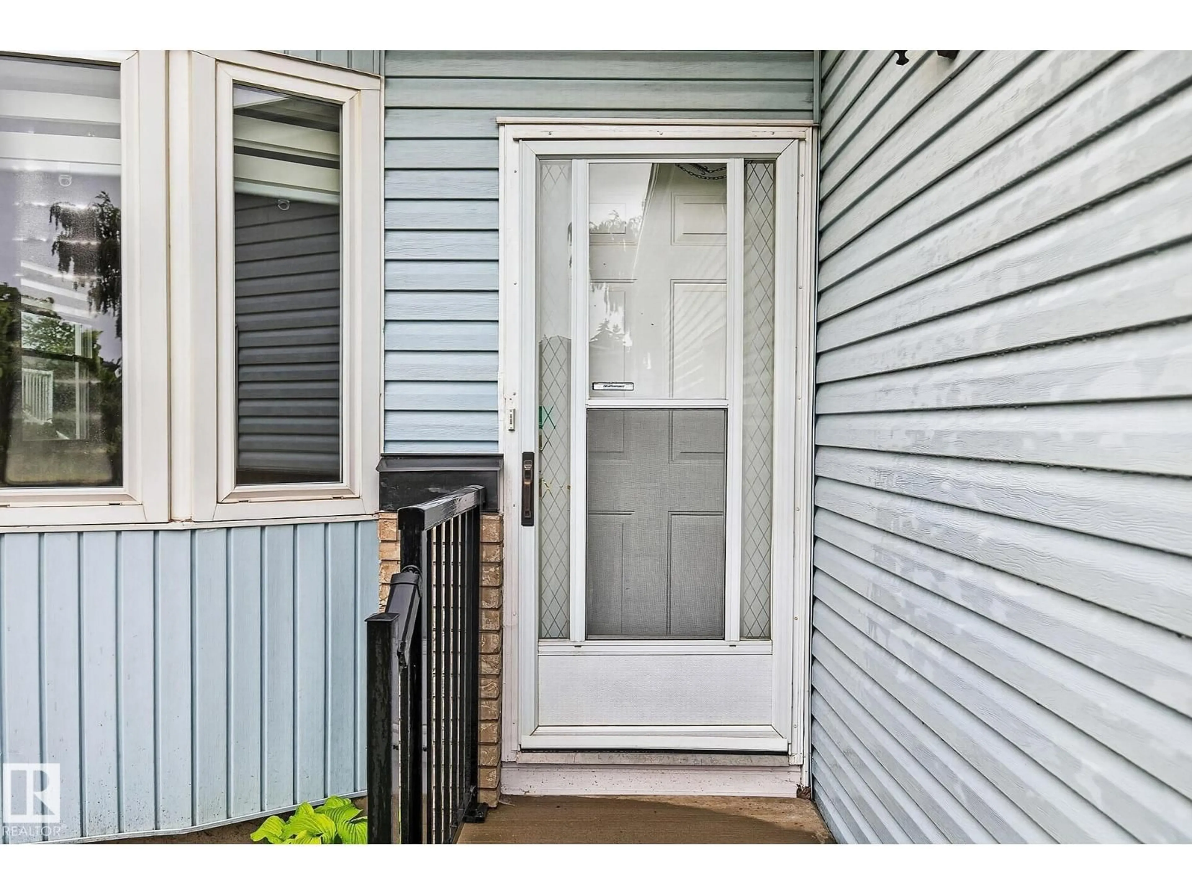 Home with vinyl exterior material, street for NW - 12443 55 ST, Edmonton Alberta T5W5E7