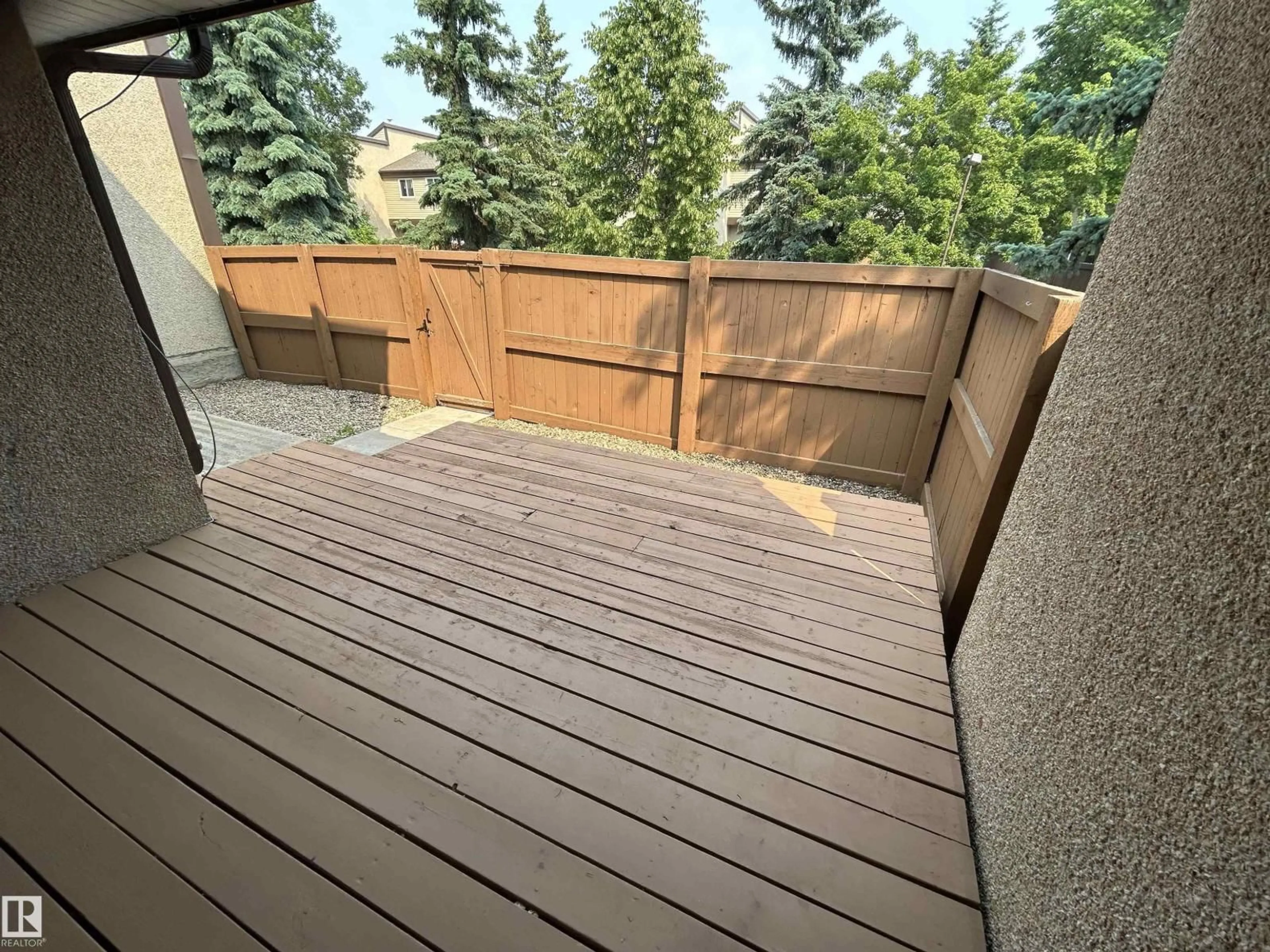 Patio, forest/trees view for NW - 7117 180 ST, Edmonton Alberta T5T3G1