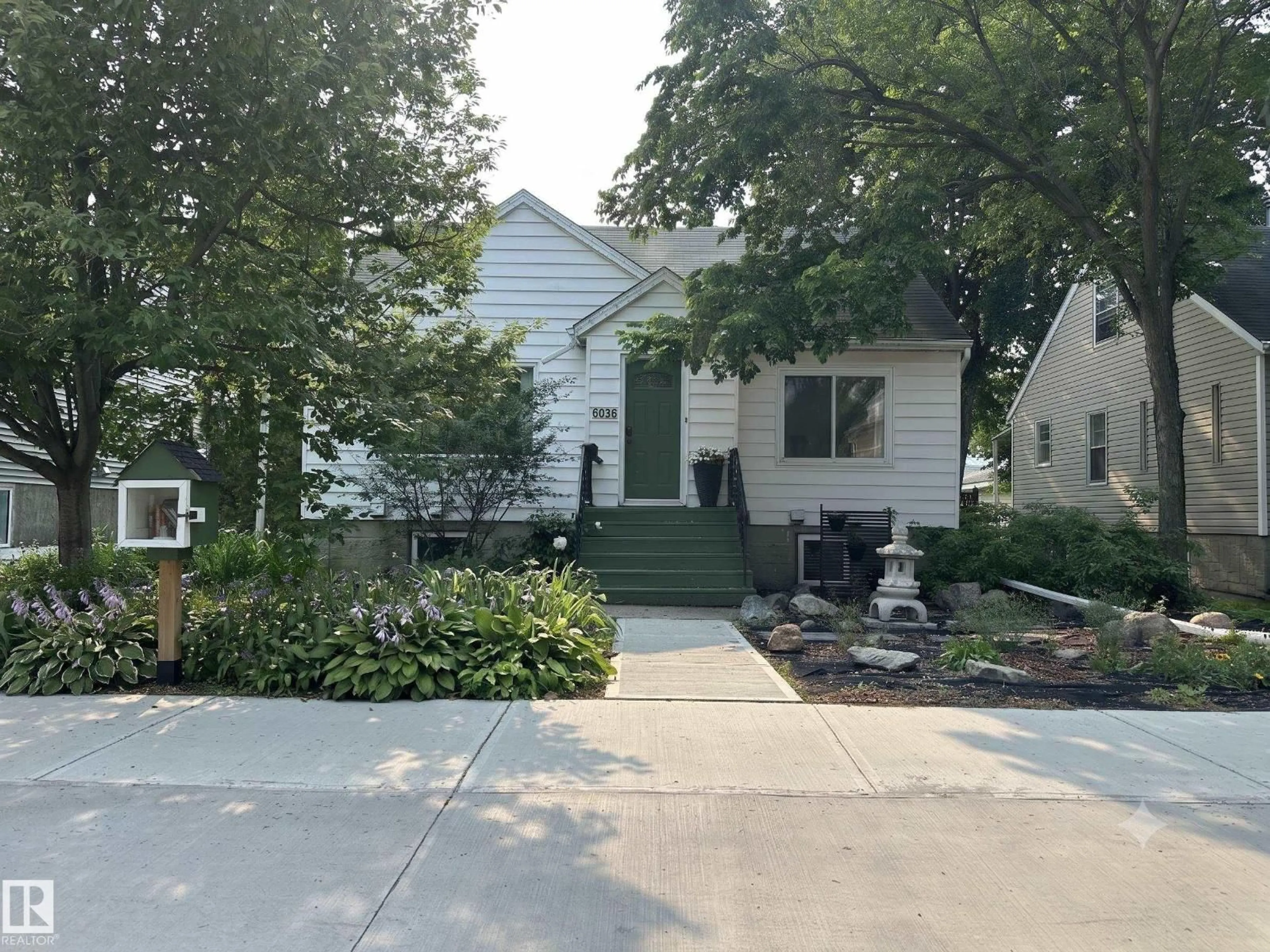 Home with vinyl exterior material, street for 6036 106 ST, Edmonton Alberta T6H2T7