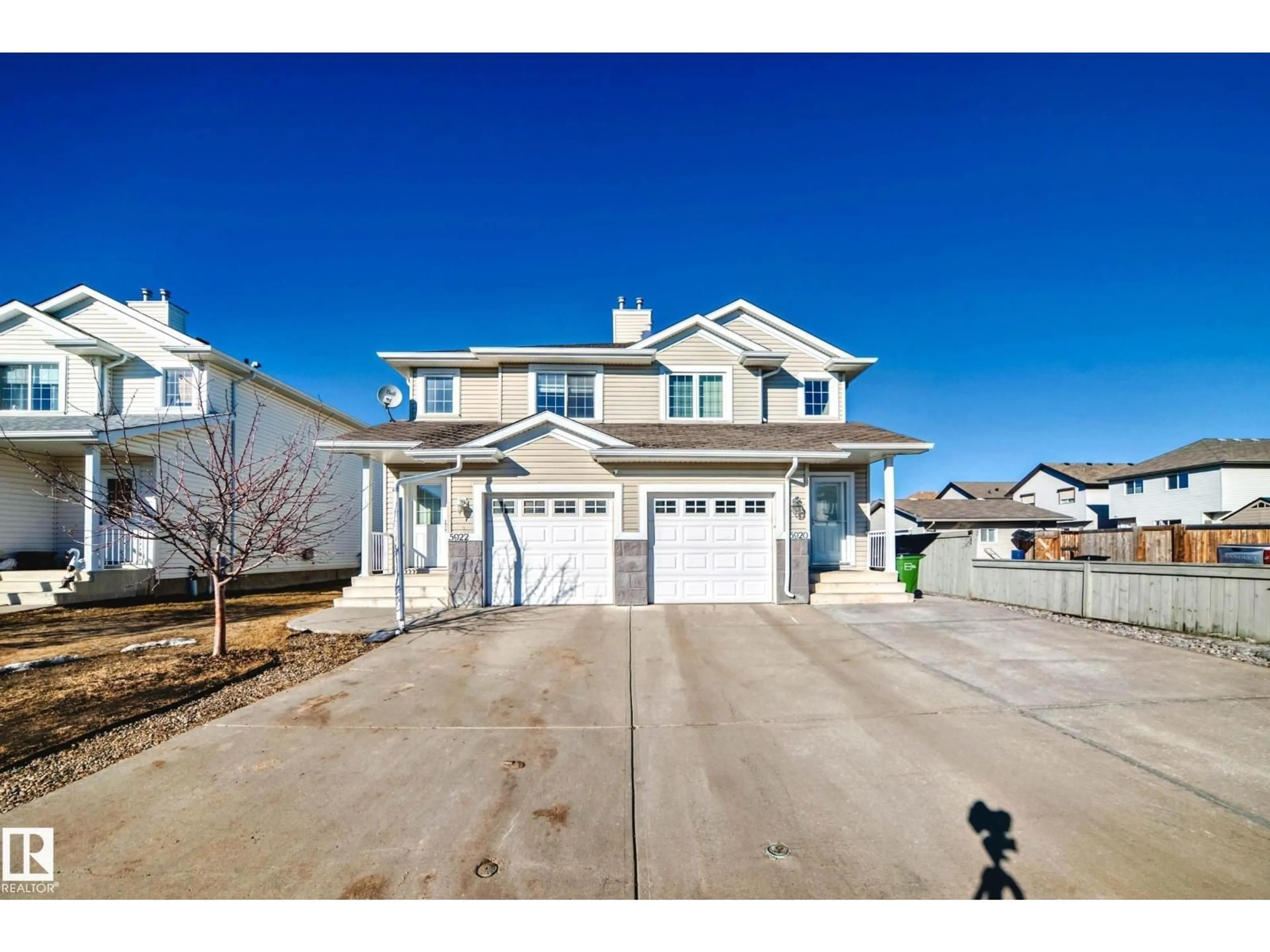 Home with vinyl exterior material, street for 5922 164 AV, Edmonton Alberta T5Y0B3