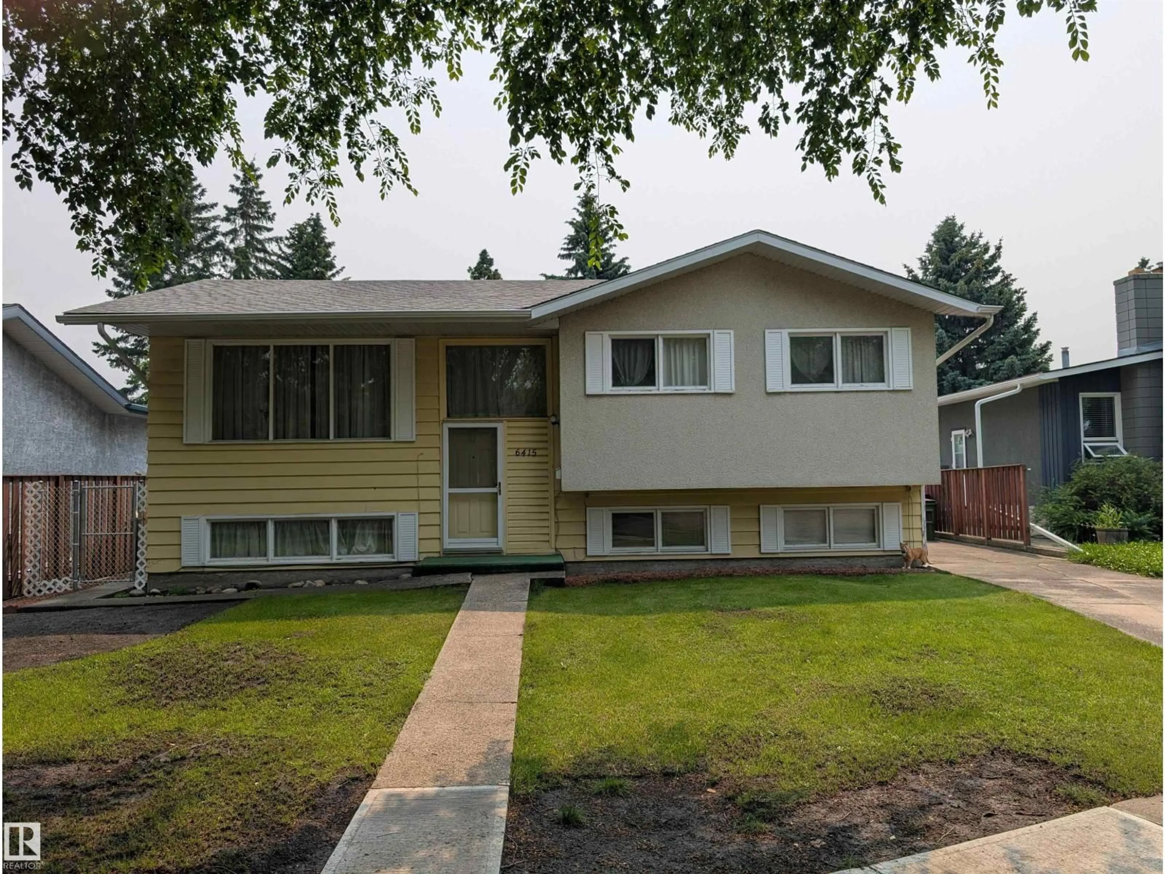 Home with vinyl exterior material, street for 6415 147 AV, Edmonton Alberta T5A1T6