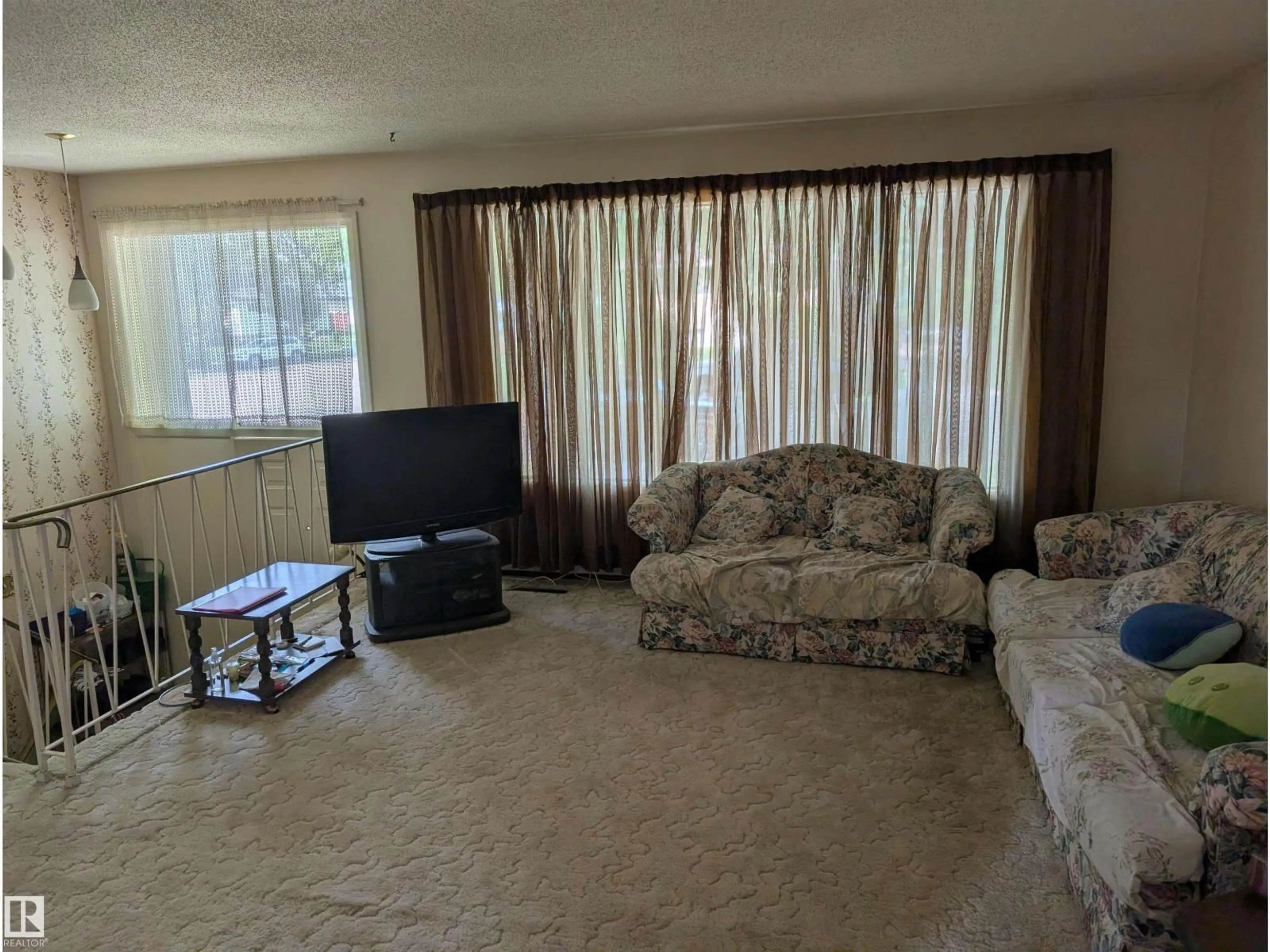 Living room with furniture, unknown for 6415 147 AV, Edmonton Alberta T5A1T6