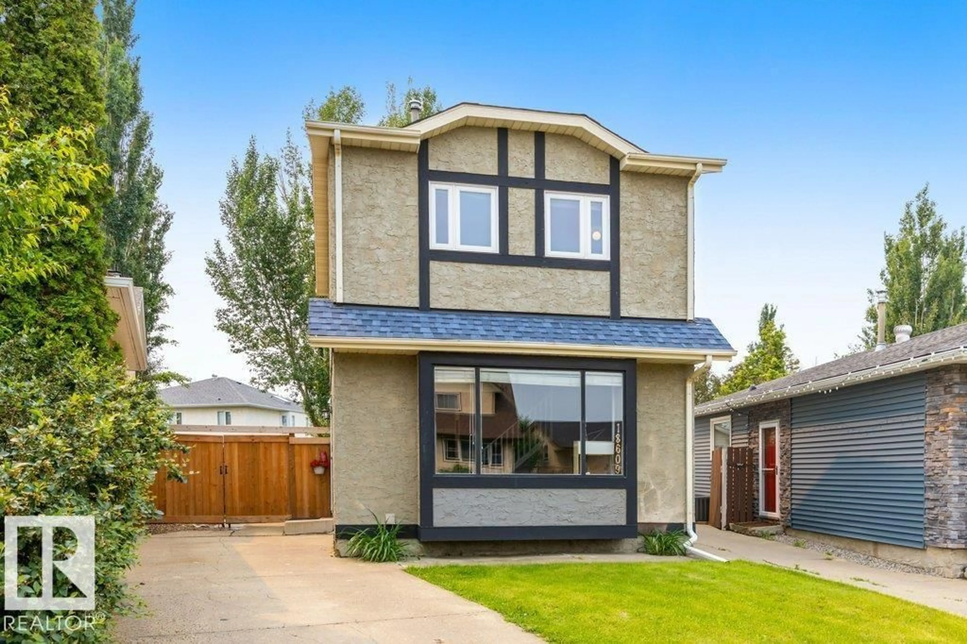 Home with brick exterior material, street for 18609 54 AV, Edmonton Alberta T6M1Z4