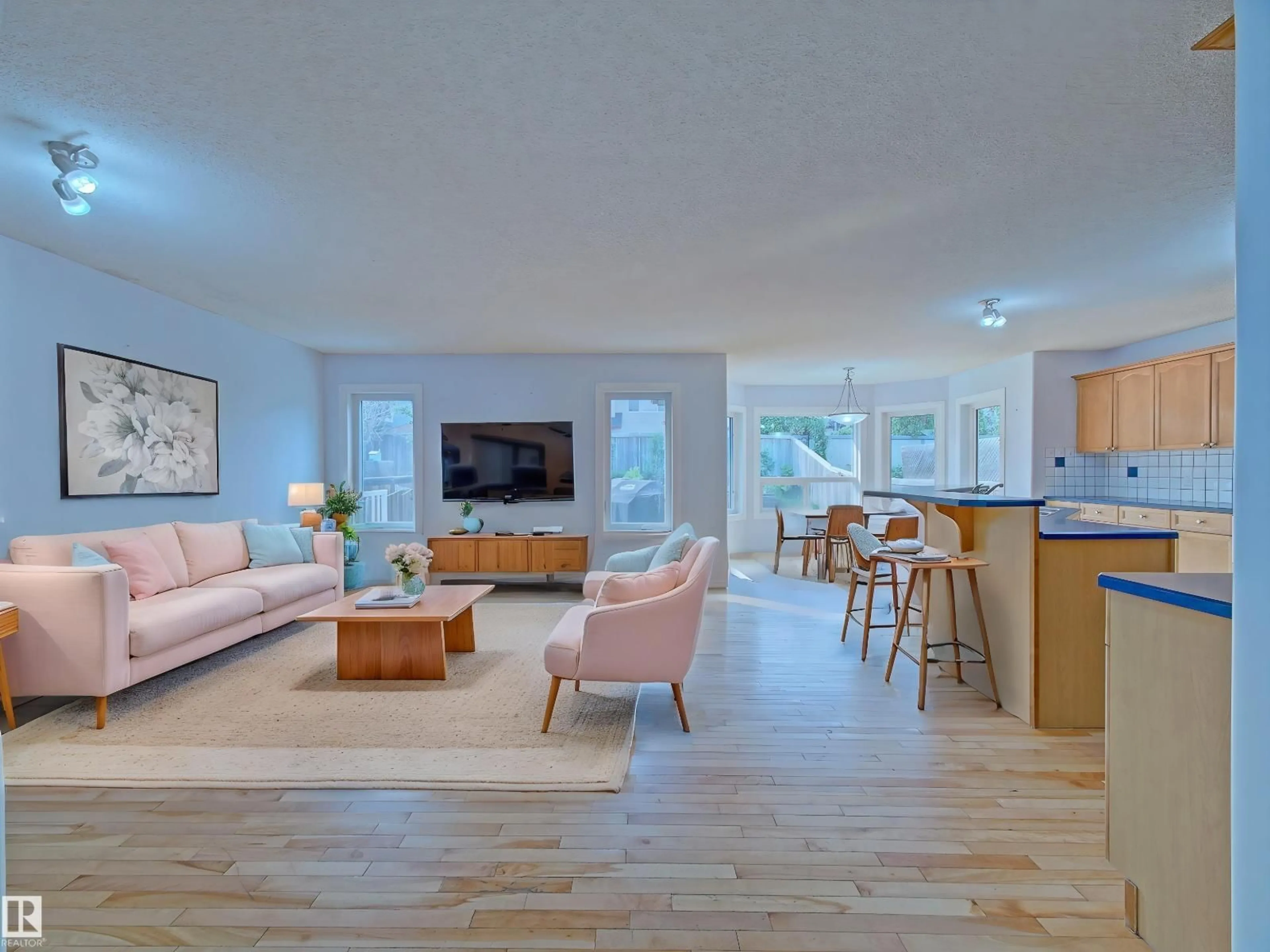 Living room with furniture, wood/laminate floor for 13 ALMOND BA, Fort Saskatchewan Alberta T8L0A4