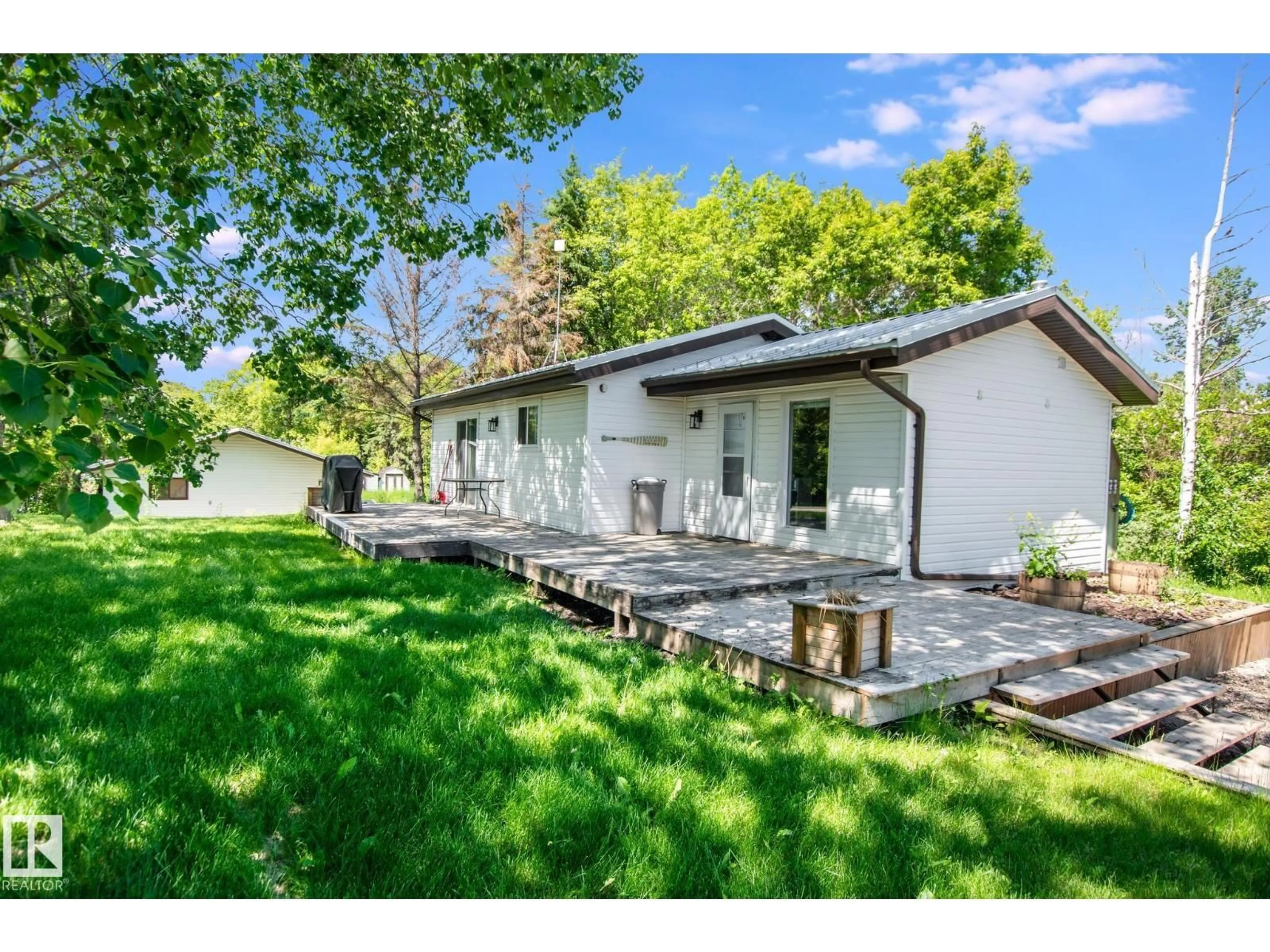 A pic from outside/outdoor area/front of a property/back of a property/a pic from drone, street for #302 - 61314 RGE RD 463, Rural Bonnyville M.D. Alberta T9N2J6