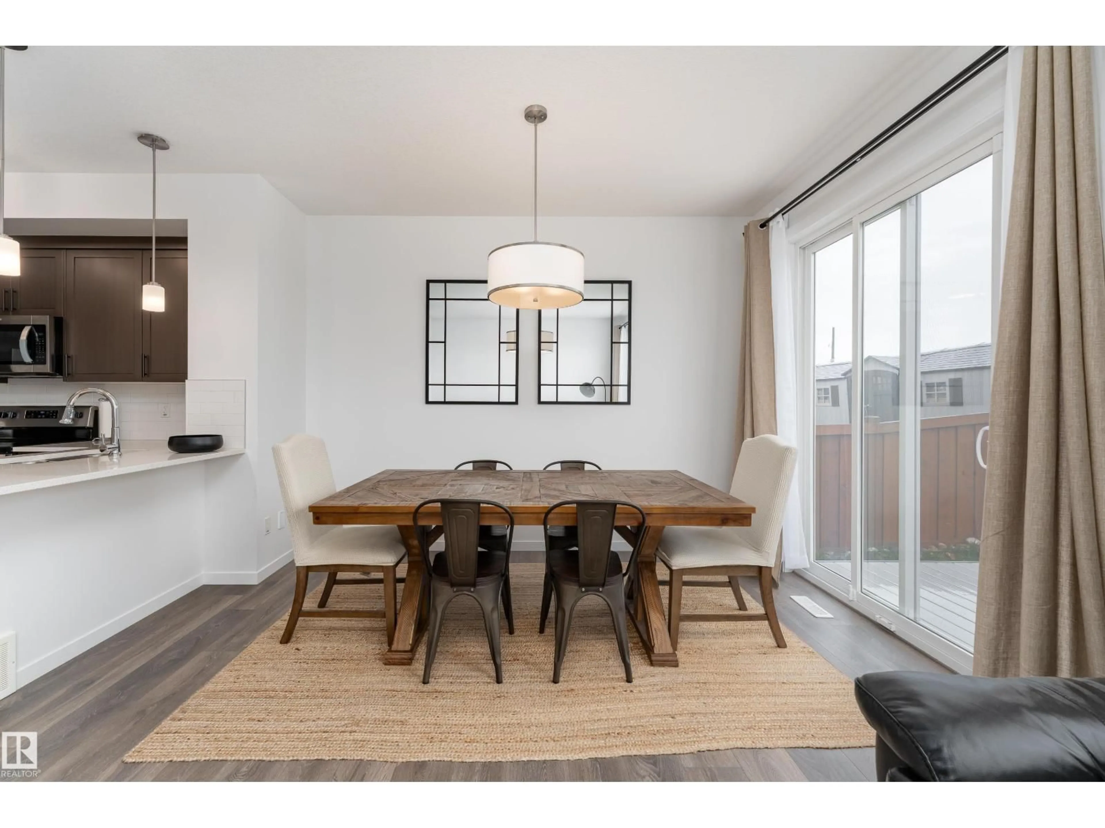 Dining room, wood/laminate floor for NW - 2522 152 AV, Edmonton Alberta T5Y3Z1