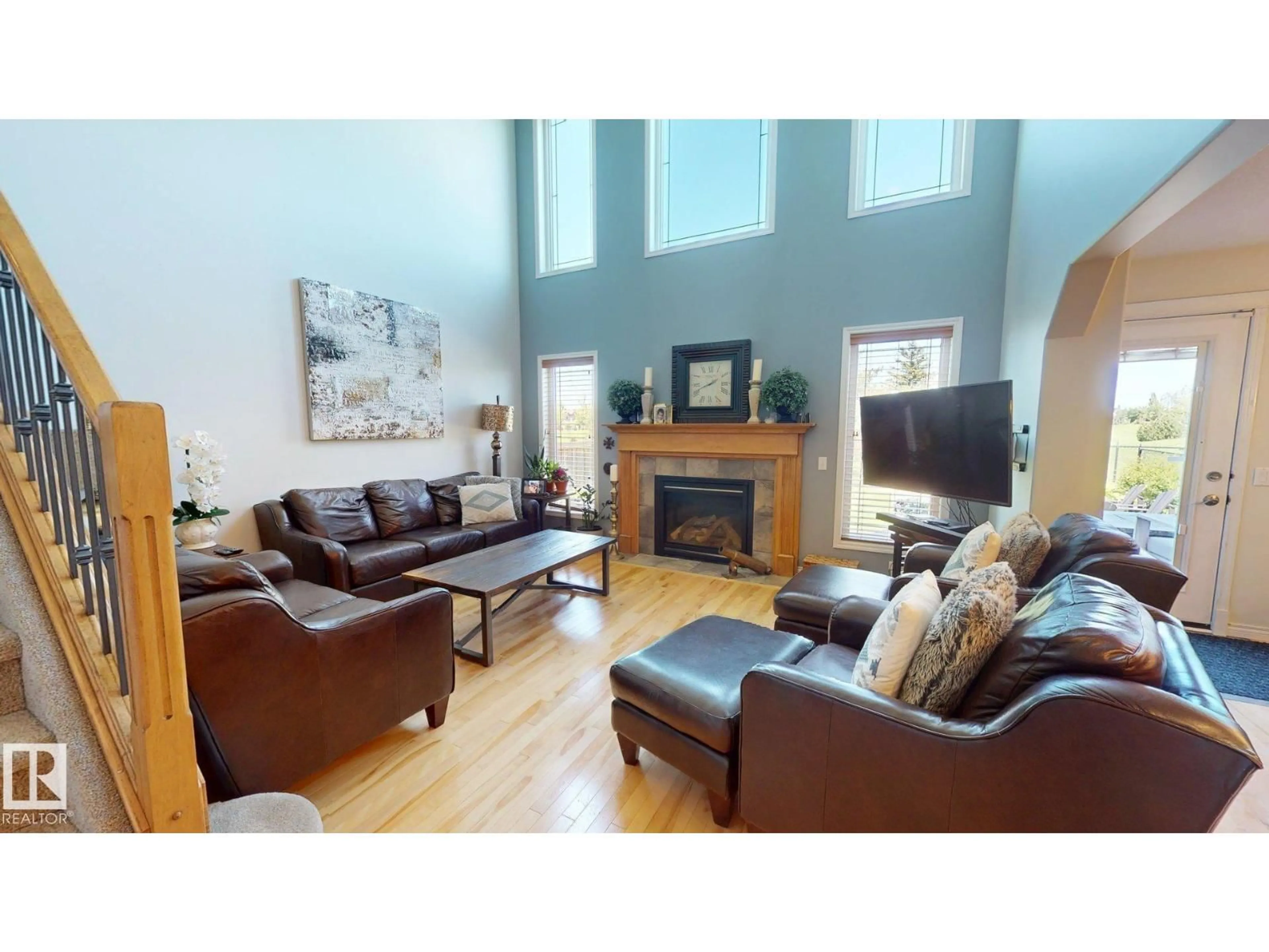 Living room with furniture, wood/laminate floor for 19 NAPOLEON CR, St. Albert Alberta T8N1C6