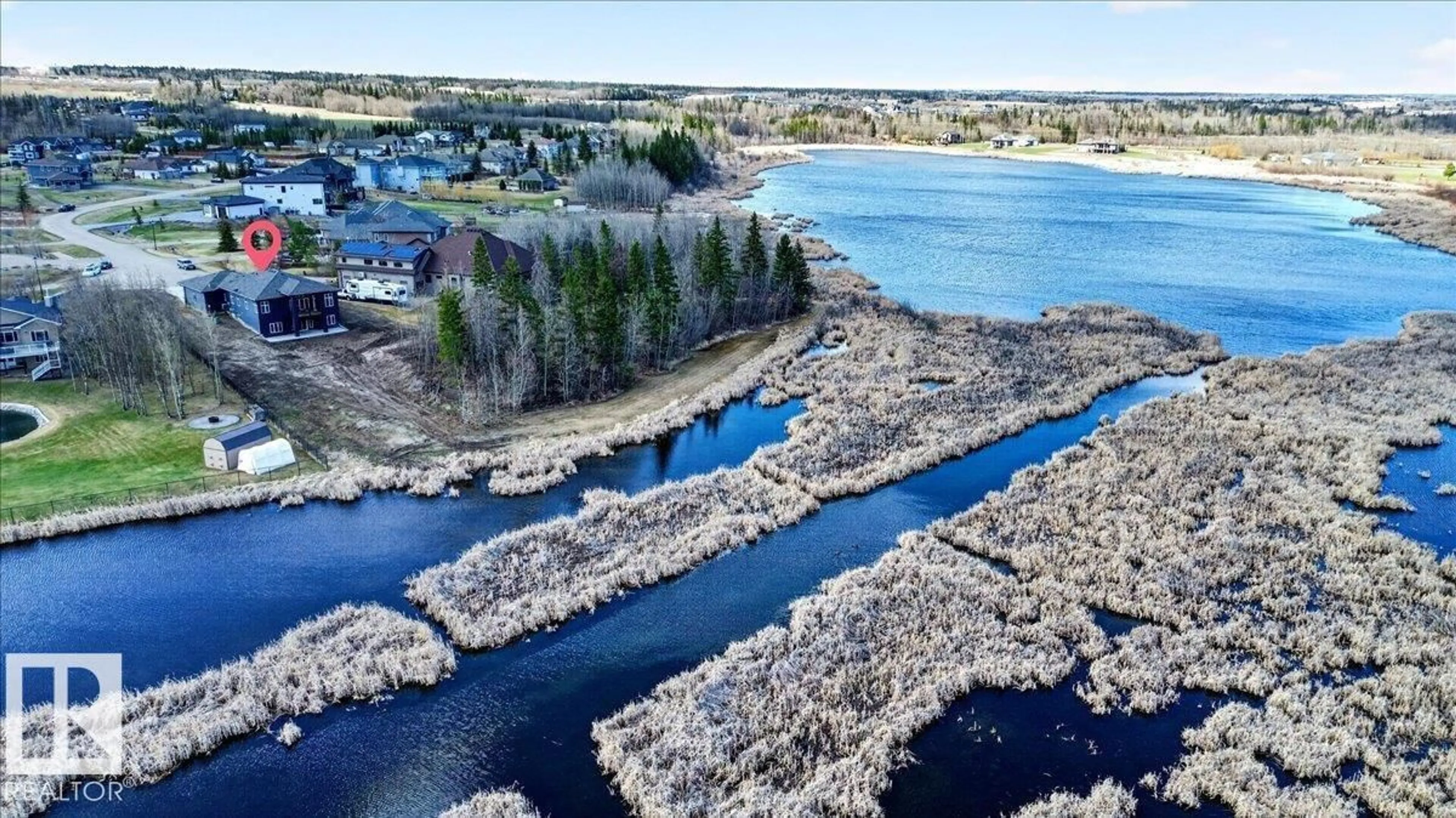 A pic from outside/outdoor area/front of a property/back of a property/a pic from drone, water/lake/river/ocean view for 31 TOWNSHIP ROAD 532A, Rural Parkland County Alberta T7X4M1