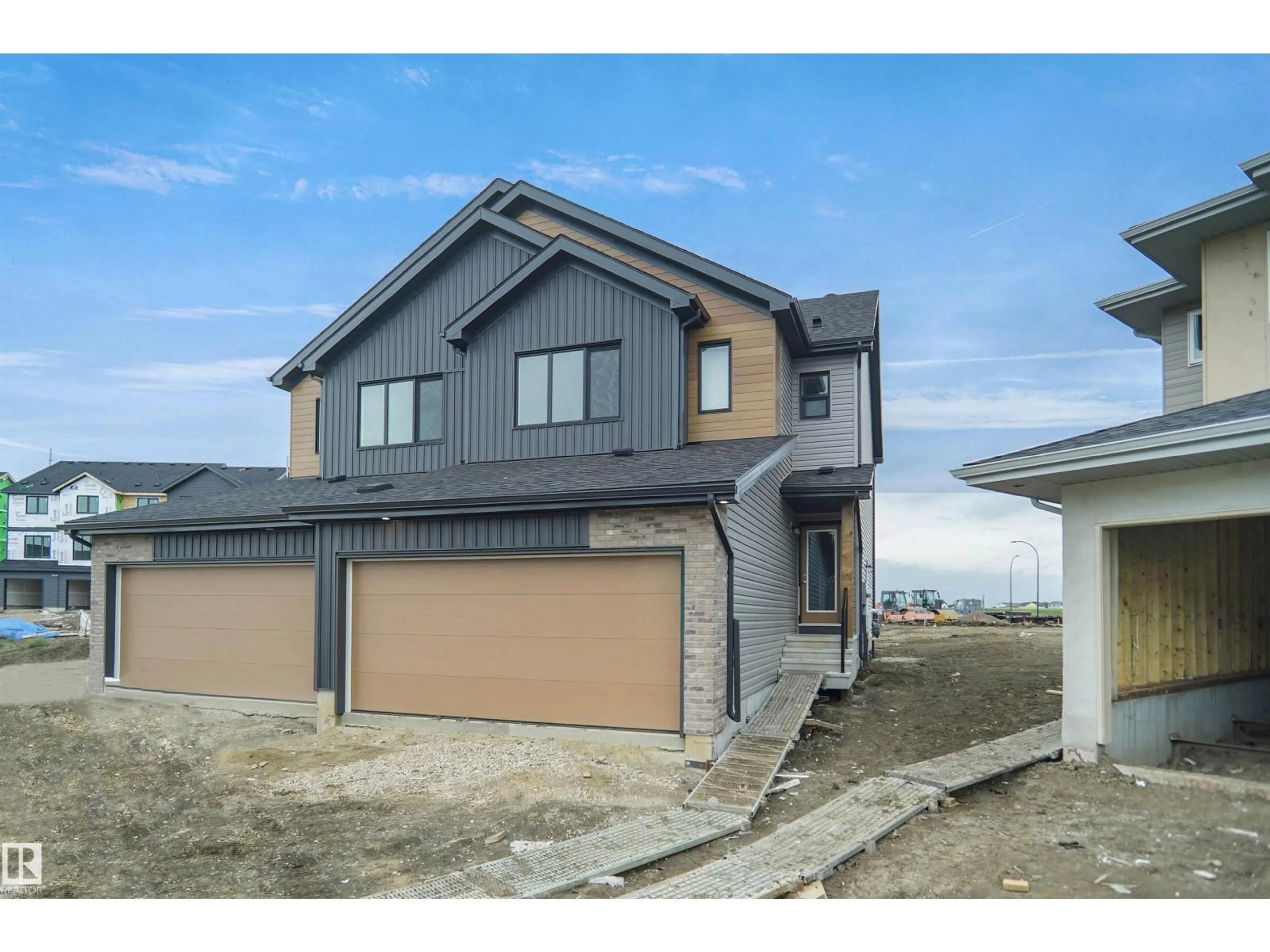 Home with vinyl exterior material, street for NW - 1822 188 ST, Edmonton Alberta T6M3N7