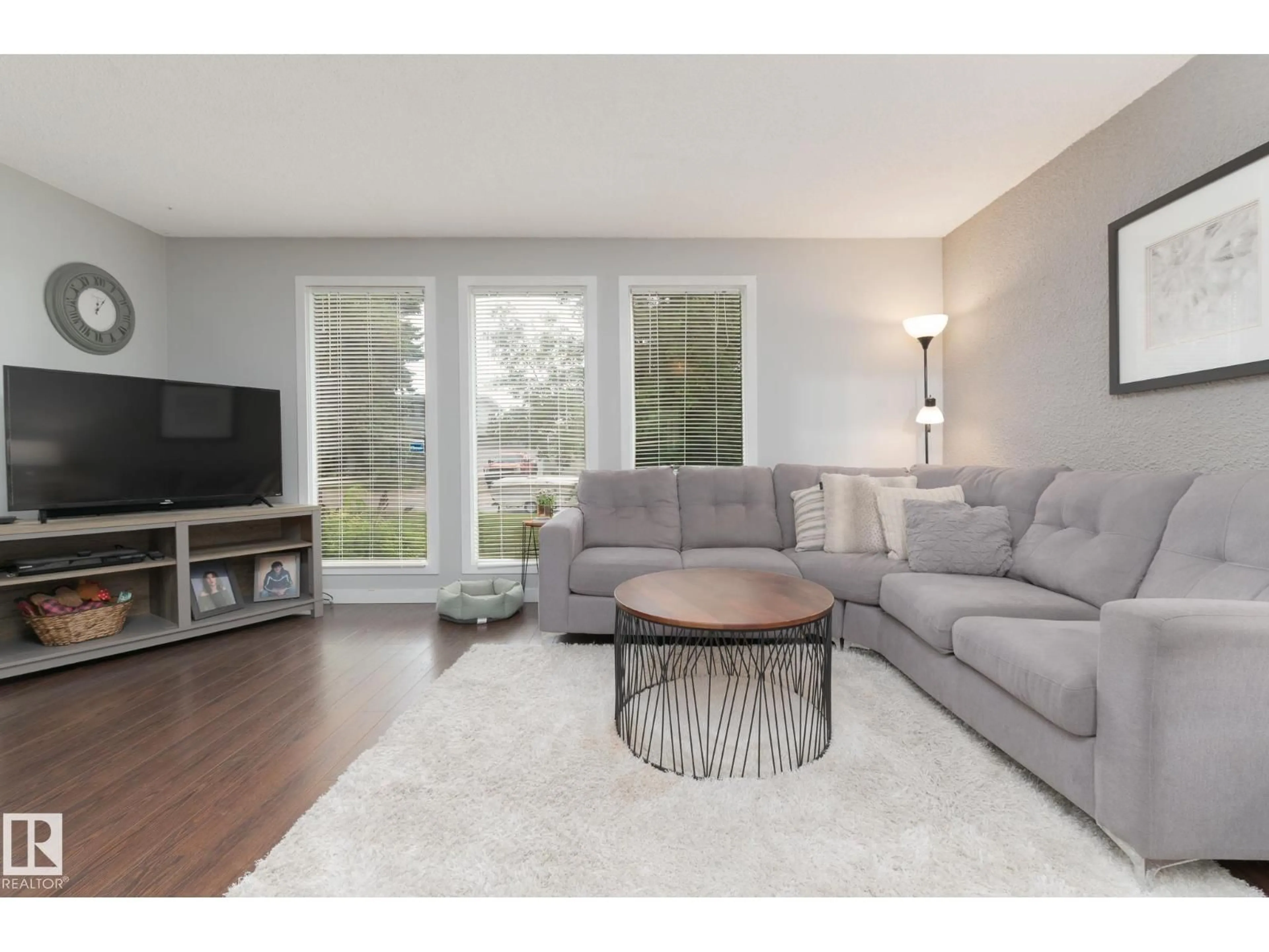 Living room with furniture, wood/laminate floor for 63 WAVERLEY CR, Spruce Grove Alberta T7X1N9