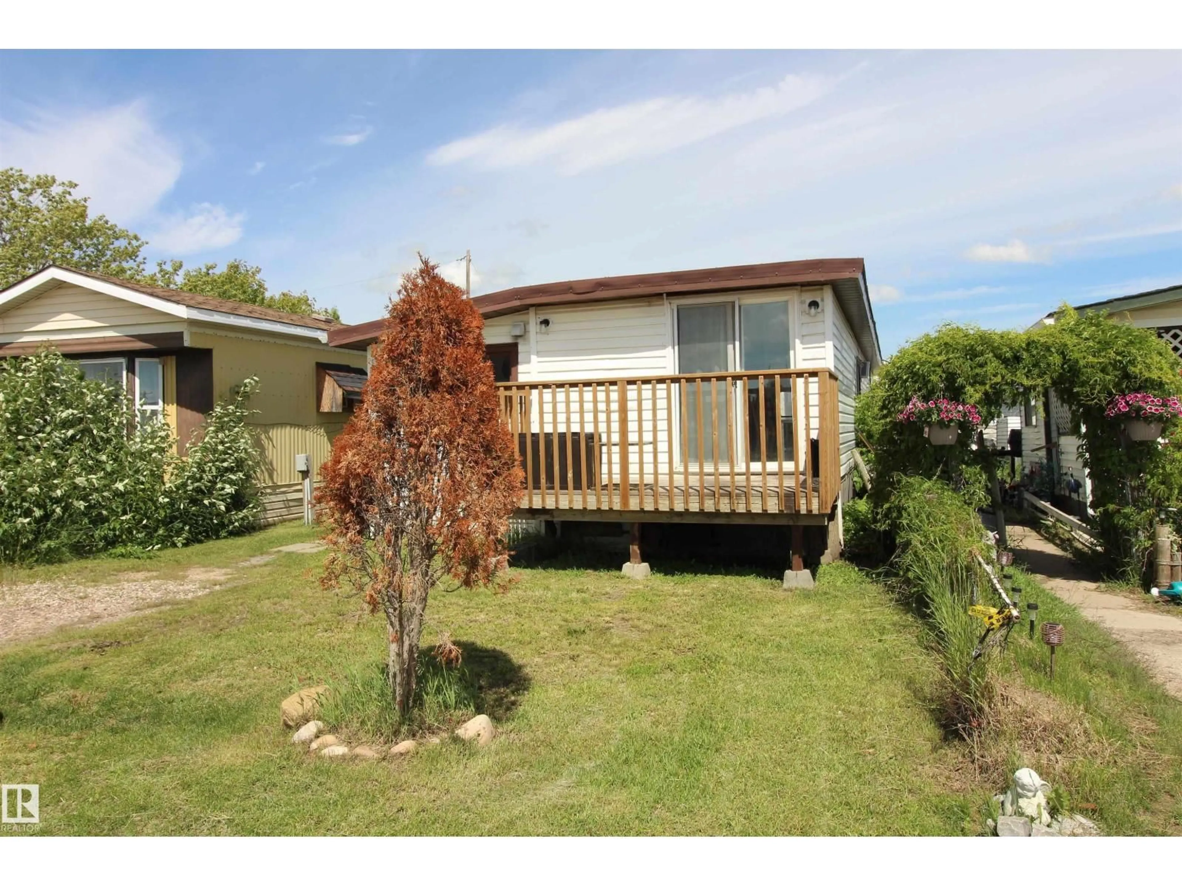 A pic from outside/outdoor area/front of a property/back of a property/a pic from drone, street for 12 - 10808 101 ST, Westlock Alberta T7P1H4
