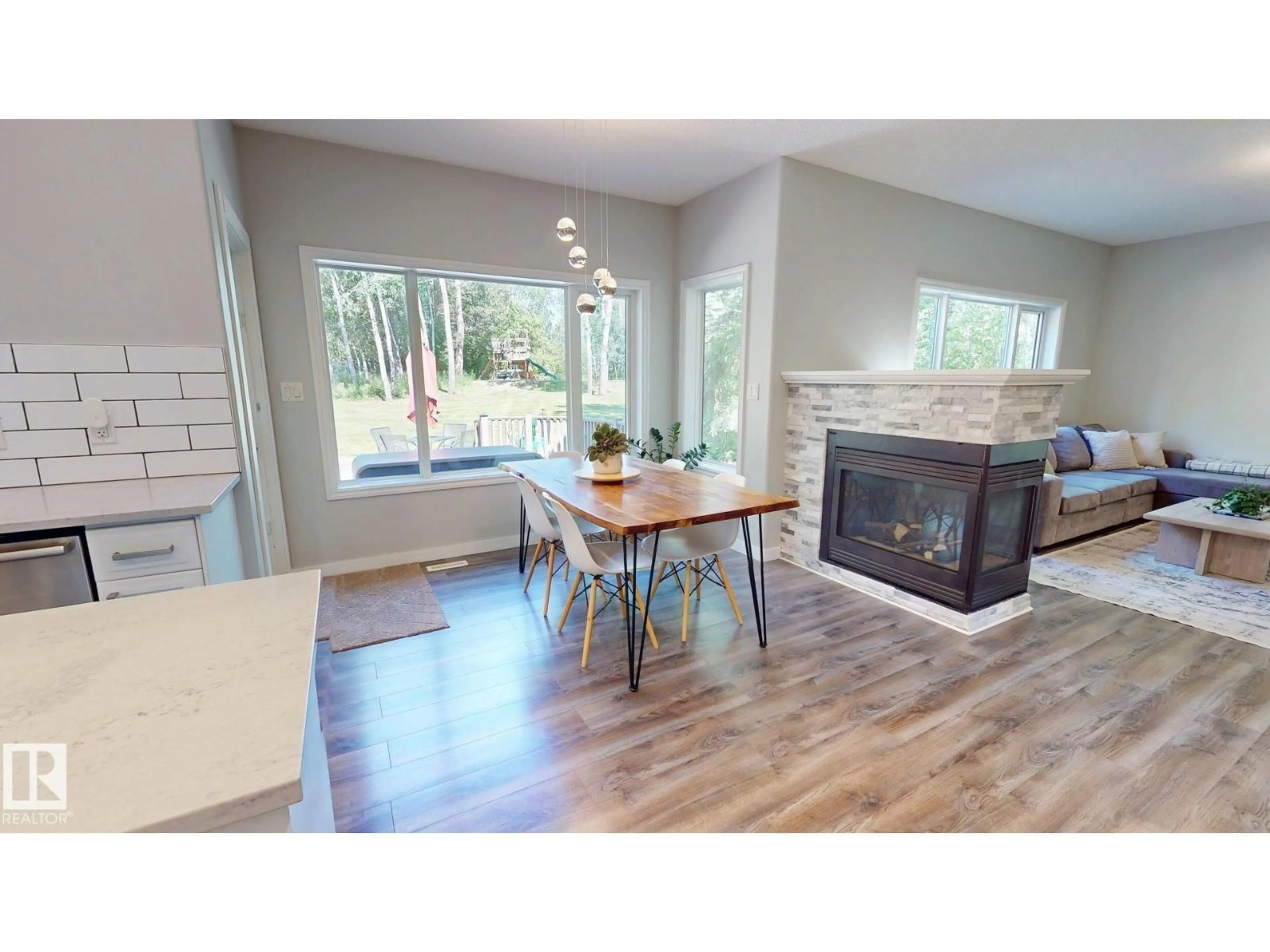 Open concept kitchen, wood/laminate floor for 13 27107 TWP ROAD 510, Rural Parkland County Alberta T7Y1H6
