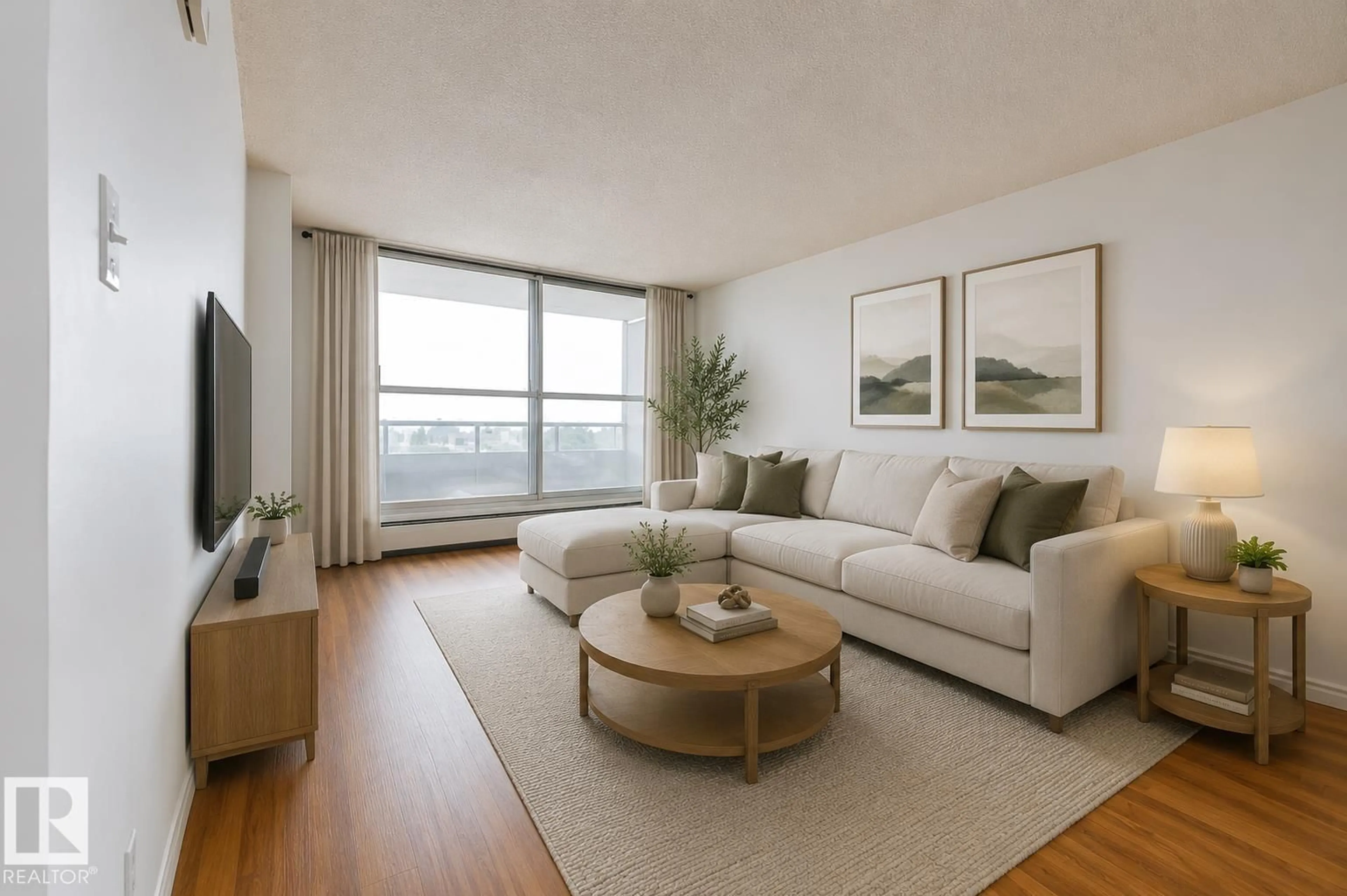 Living room with furniture, wood/laminate floor for 13910 - 613 STONY PLAIN RD, Edmonton Alberta T5N3R2