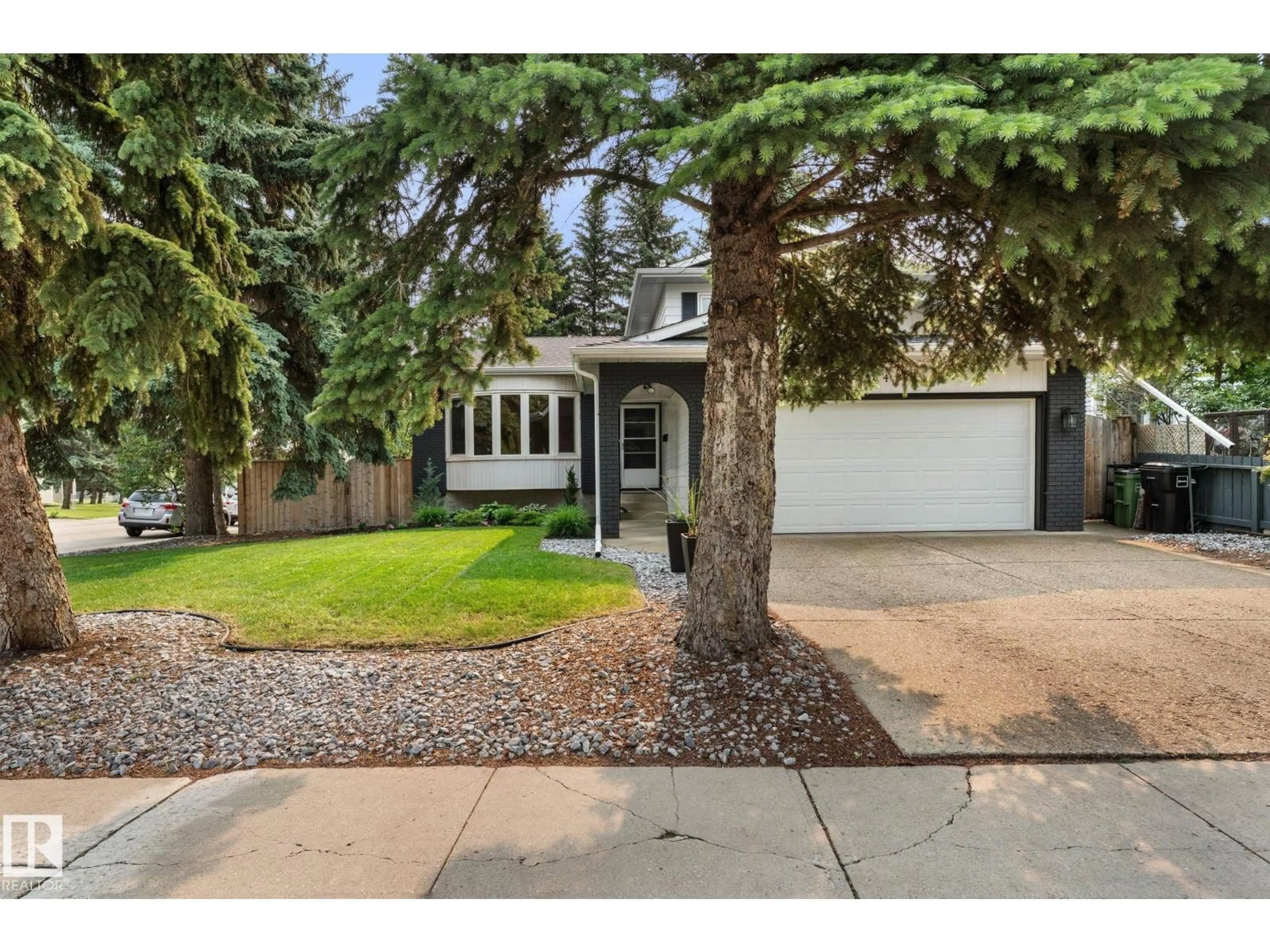 Home with vinyl exterior material, street for NW - 2451 115 ST, Edmonton Alberta T6J4Z2
